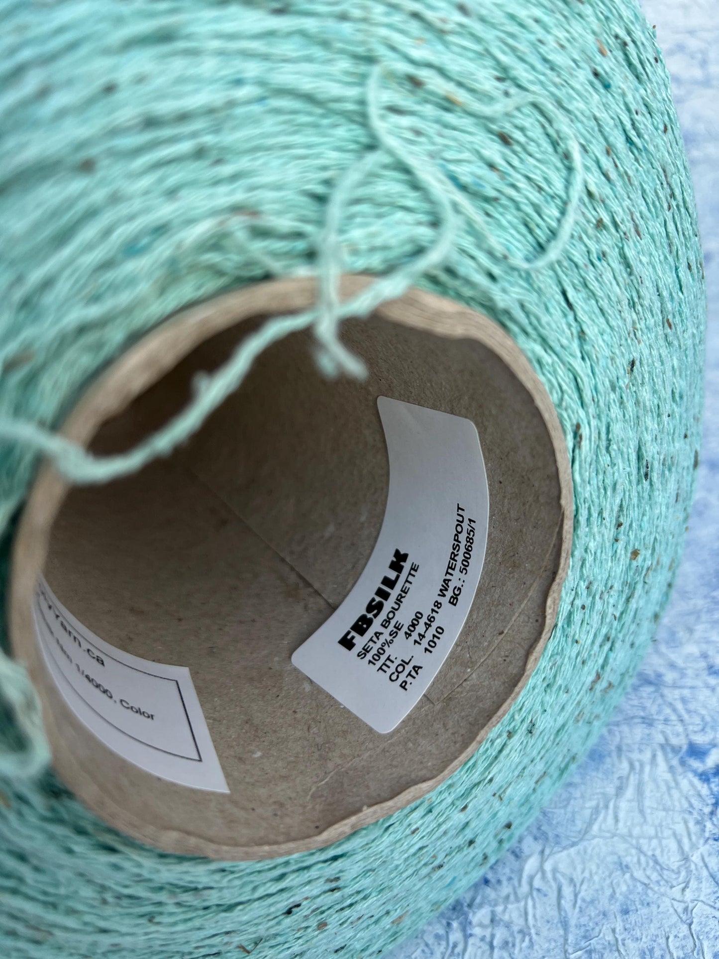 Silk Bourette yarn 100%, Nm 4000, Color Light Cyan. Per 100 gr