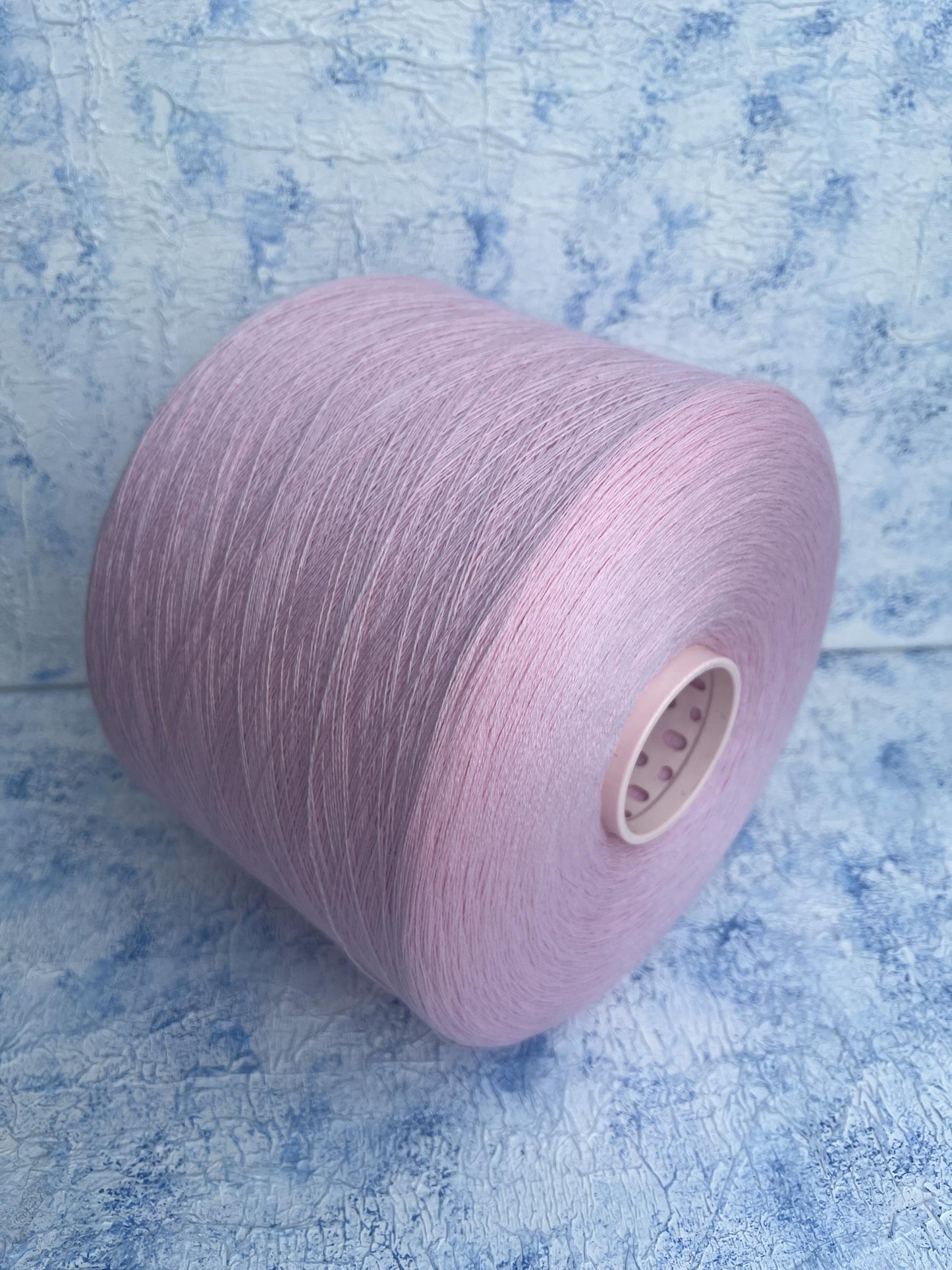 100% Merino yarn on cone, Color Pink. Per 100 gr