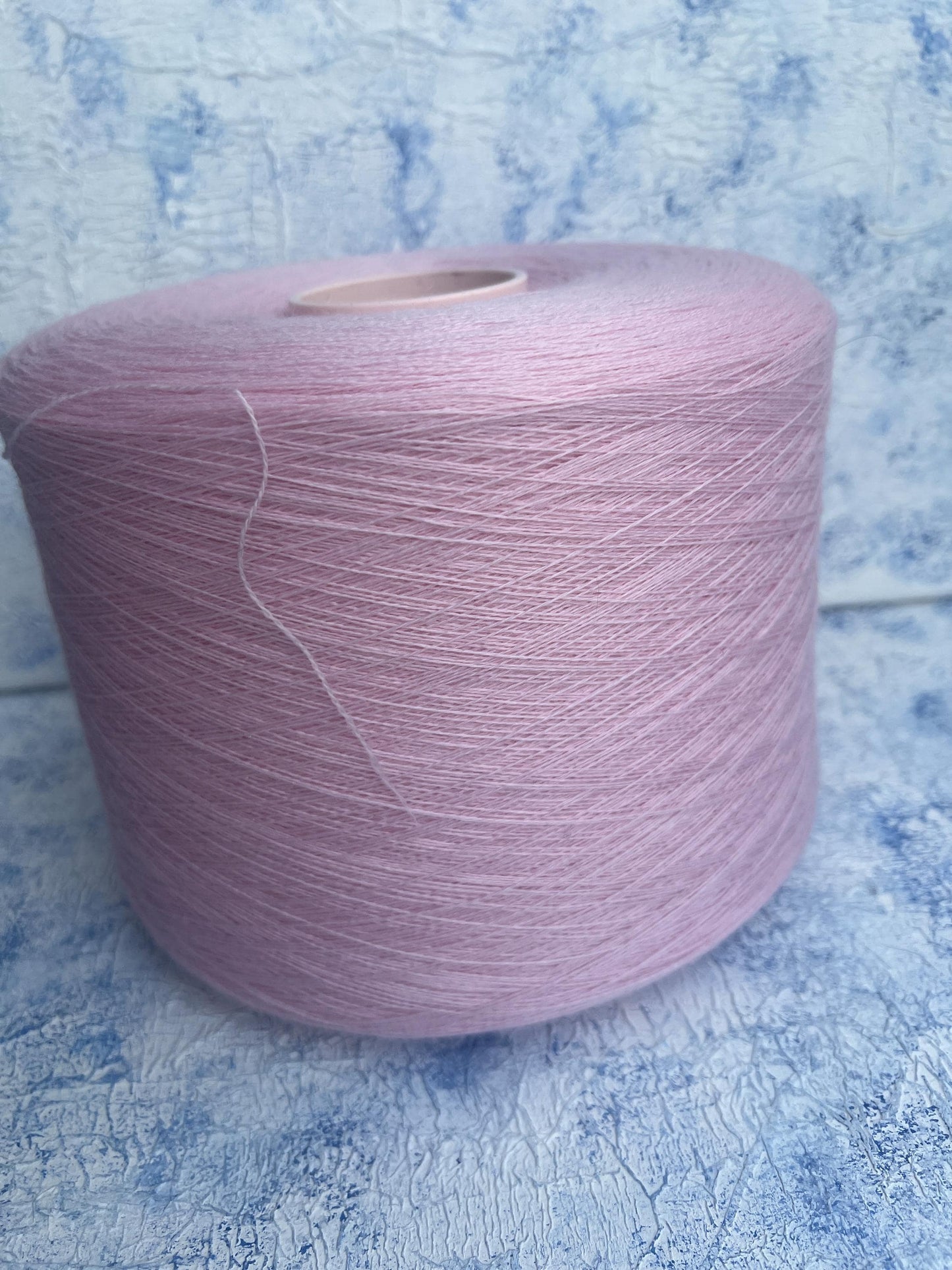 100% Merino yarn on cone, Color Pink. Per 100 gr