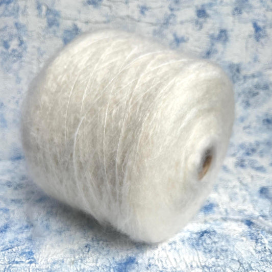 70% Kid Mohair&15% Wool&15% PA yarn on Cone. White.Per 100 gr