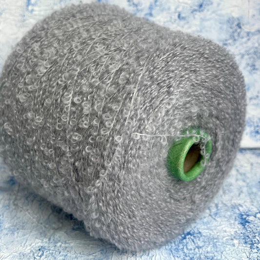 Boucle Kid Mohair 75% & Silk 25% yarnon cone-Gray. Per 100 gr