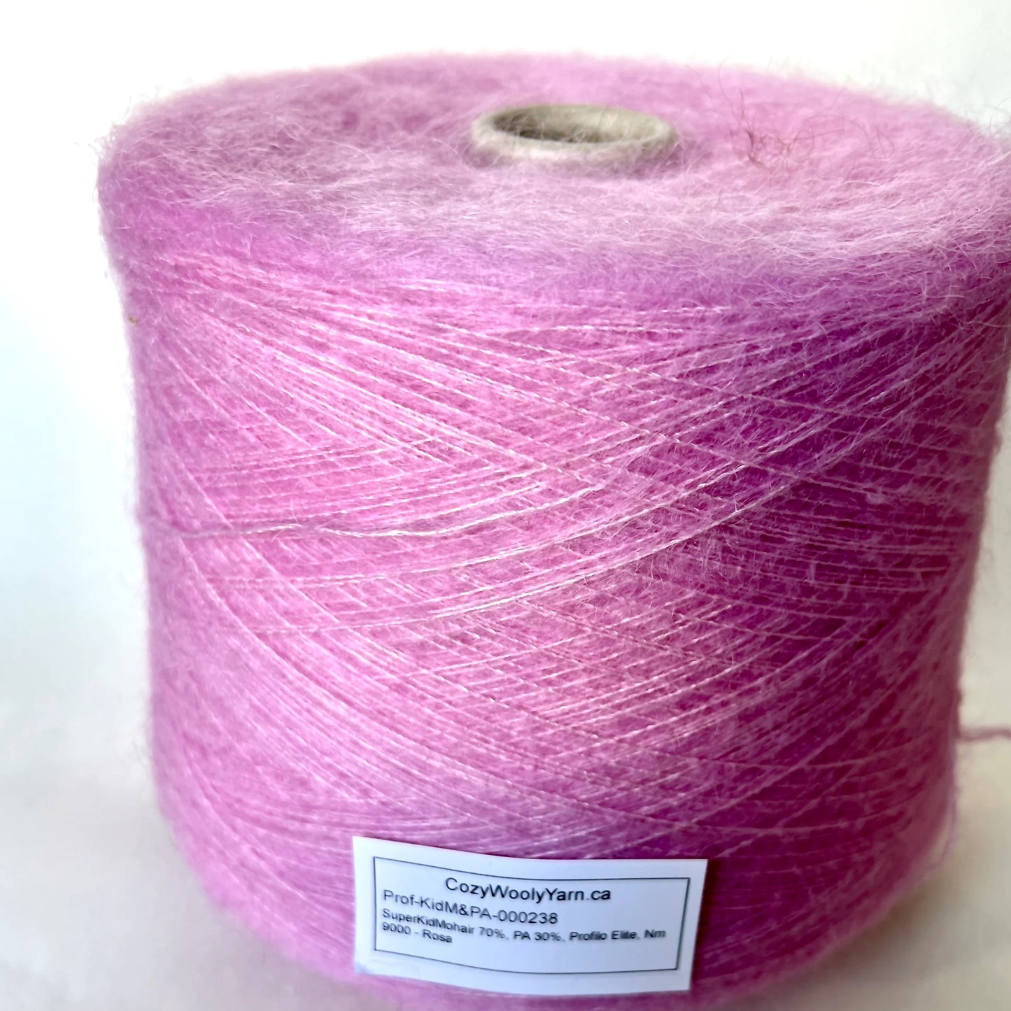 Super Kid Mohair Yarn & Poliamide Yarn. Yarn on Cone. Art: GLOPIA. Fibre: 70% Super kid mohair Yarn & 30% Poliamide Yarn. Color: Rosa. This is a luxurious yarn, very soft and fluffy yarn with a wonderful composition yarn of 70% Super Kid mohair yarn and 30% Poliamide yarn.