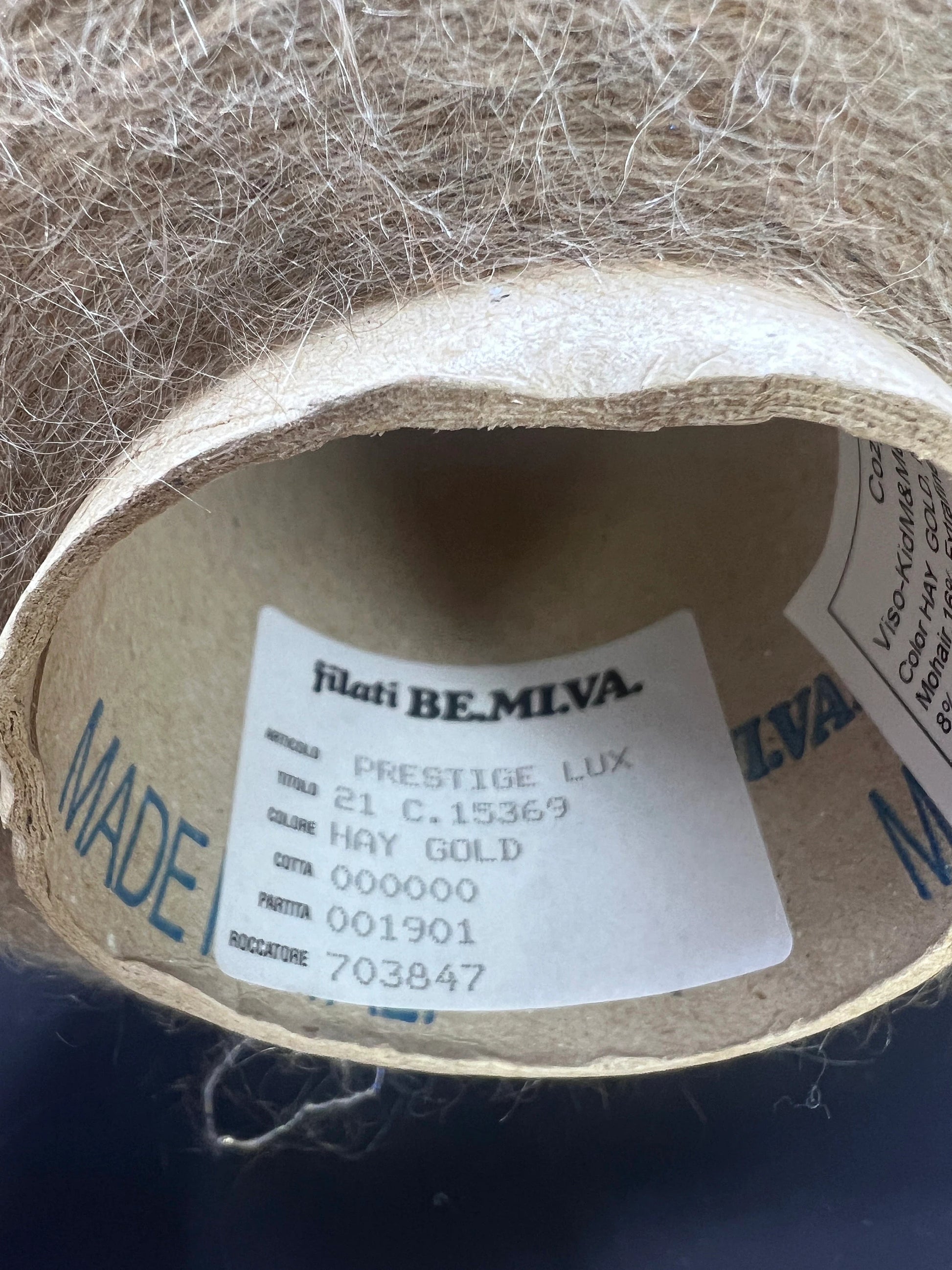 Filati Power Art: Prestige. Lux Fibre: 60% babykid mohair yarn, 16% extrafine merino wool yarn, 26% Nylon yarn, 8% Metallized yarn available at our Yarn Store in Canada. Country: Italy. Color: HAY GOLD. Yarn on cone.