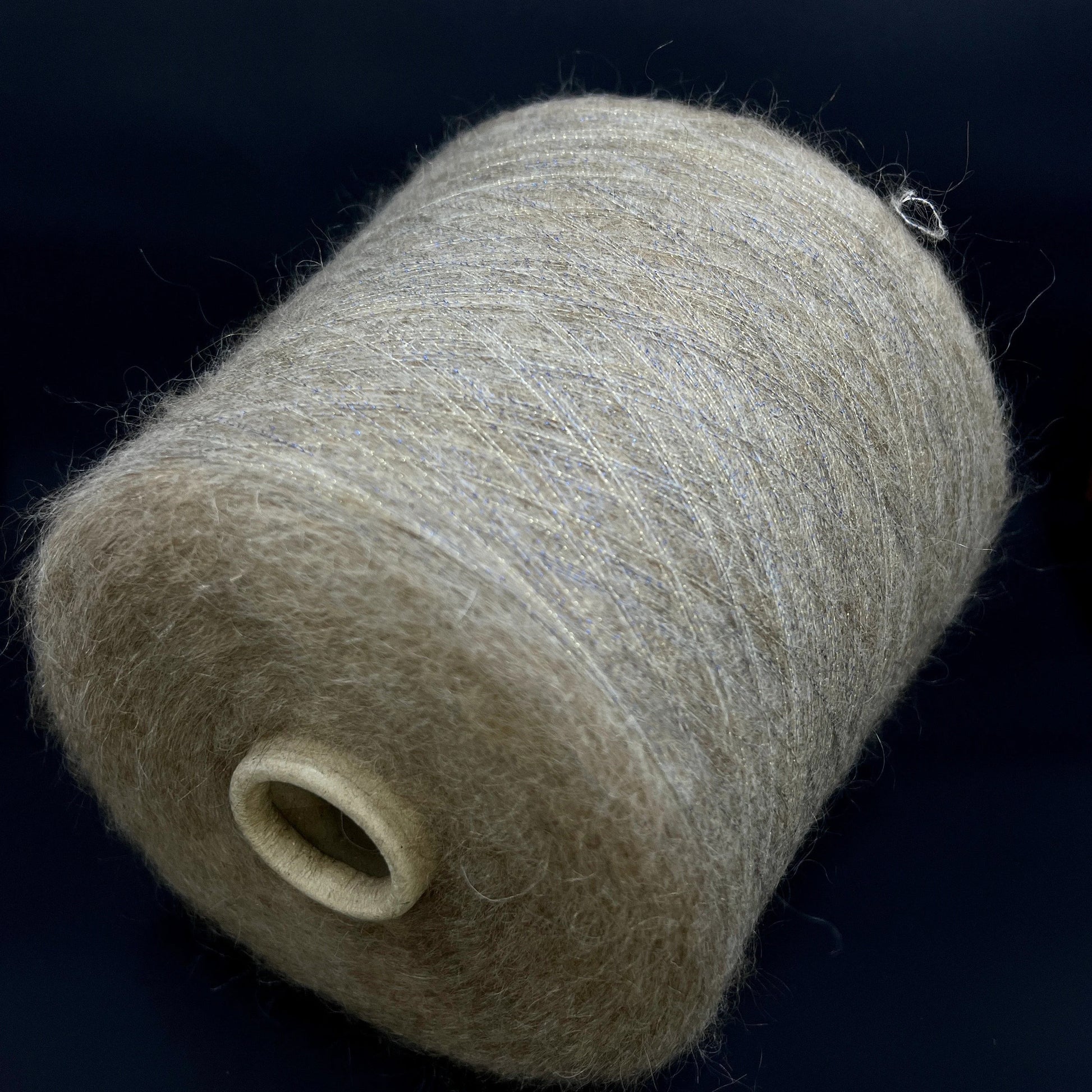 Filati Power Art: Prestige. Lux Fibre: 60% babykid mohair yarn, 16% extrafine merino wool yarn, 26% Nylon yarn, 8% Metallized yarn available at our Yarn Store in Canada. Country: Italy. Color: HAY GOLD. Yarn on cone.