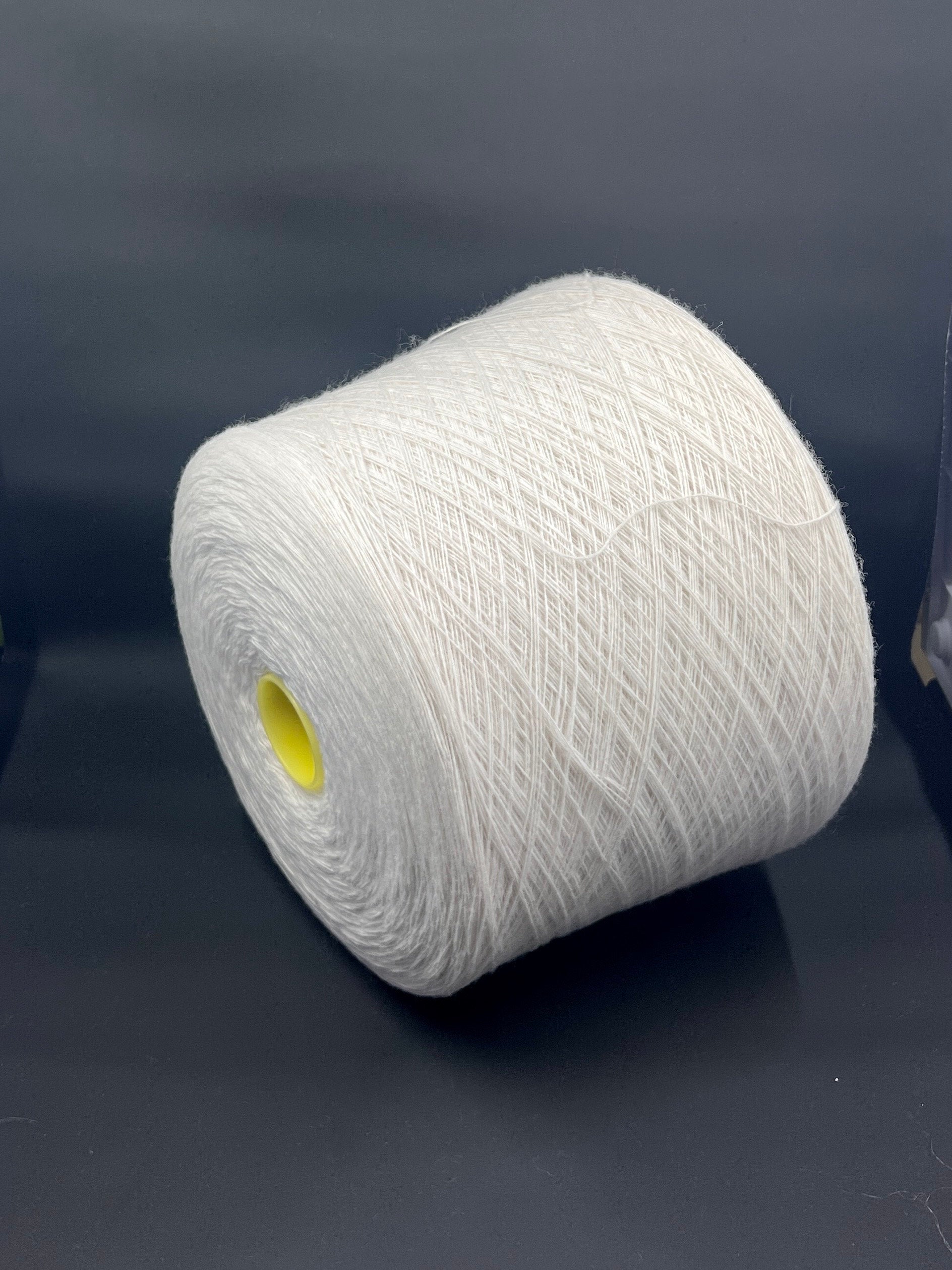 Merino Wool Yarn 100%, Supergeelong, ZEGNA BARUFFA , Color White, Yarn on Cone. Italian Lace Yarn. Hand and Machine Knitting. Fiber: 100% Merino Wool Yarn. Supergeelong Nm 1/15.  Reference: Zegna Baruffa LANE BORGOSESSIA Nm1/15. Italian Lace Yarn, Machine knitting, Hand Knitting.