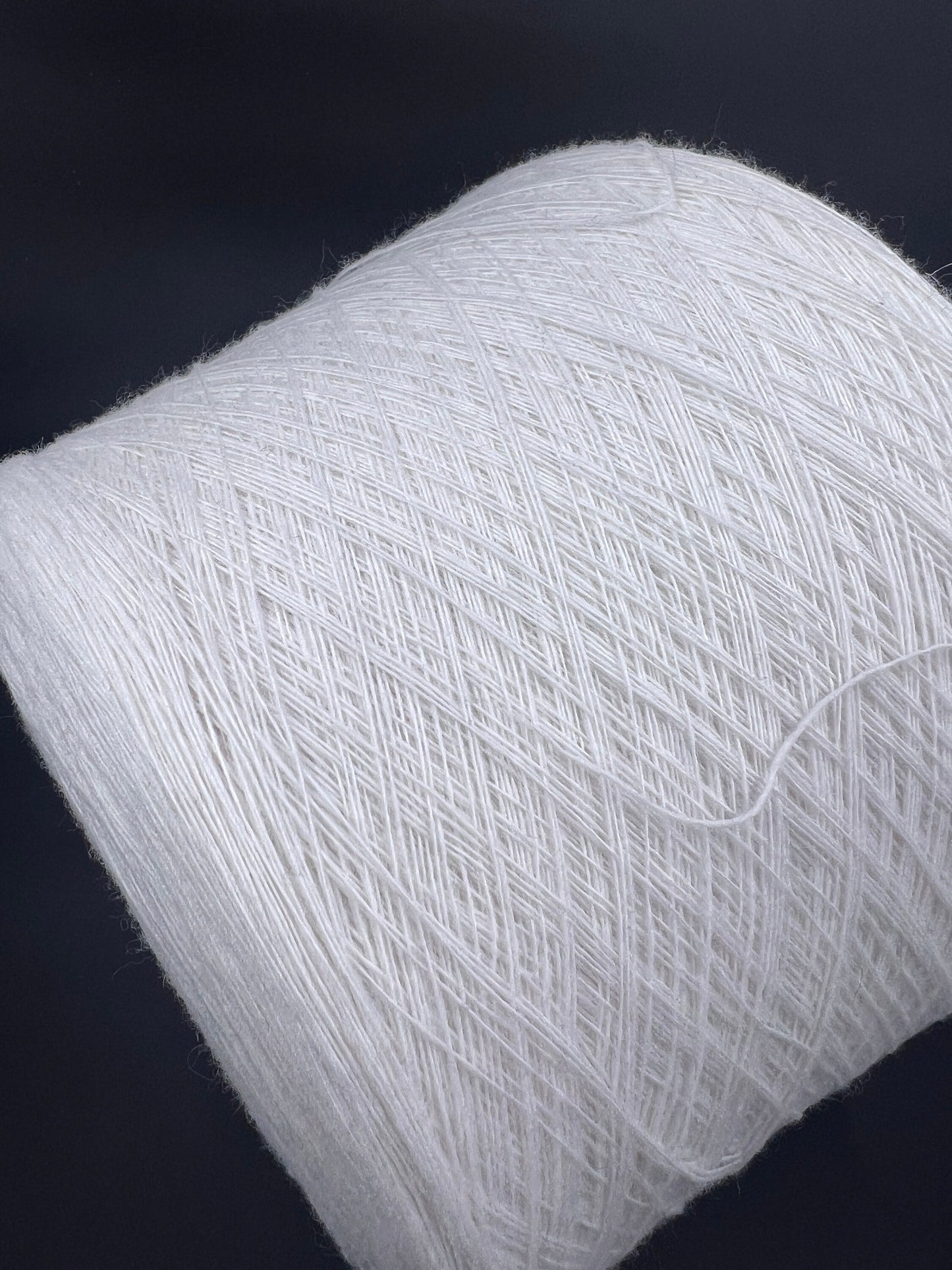 Merino Wool Yarn 100%, Supergeelong, ZEGNA BARUFFA , Color White, Yarn on Cone. Italian Lace Yarn. Hand and Machine Knitting. Fiber: 100% Merino Wool Yarn. Supergeelong Nm 1/15. Reference: Zegna Baruffa LANE BORGOSESSIA Nm1/15. Italian Lace Yarn, Machine knitting, Hand Knitting.