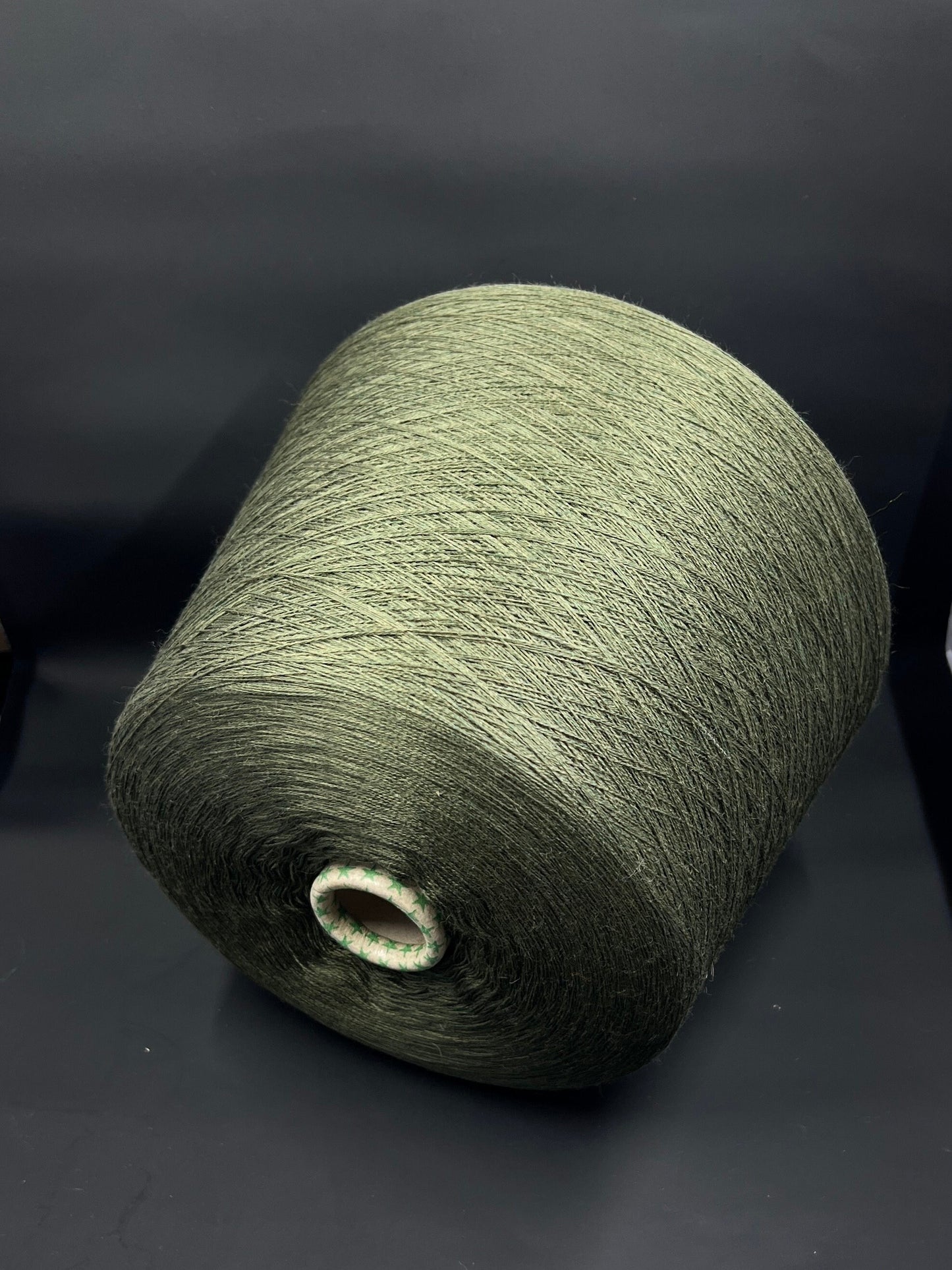 Material: 100% Extra Fine Merino Wool Yarn by Tollegno, HARMONY 4. Fiber Composition: 100% Extrafine Merino Wool yarn. Color: Oliva. Experience the luxurious softness of our 100% Fine Merino Merino Wool Yarn. This yarn showcases the exceptional quality of Extra Fine Merino wool.