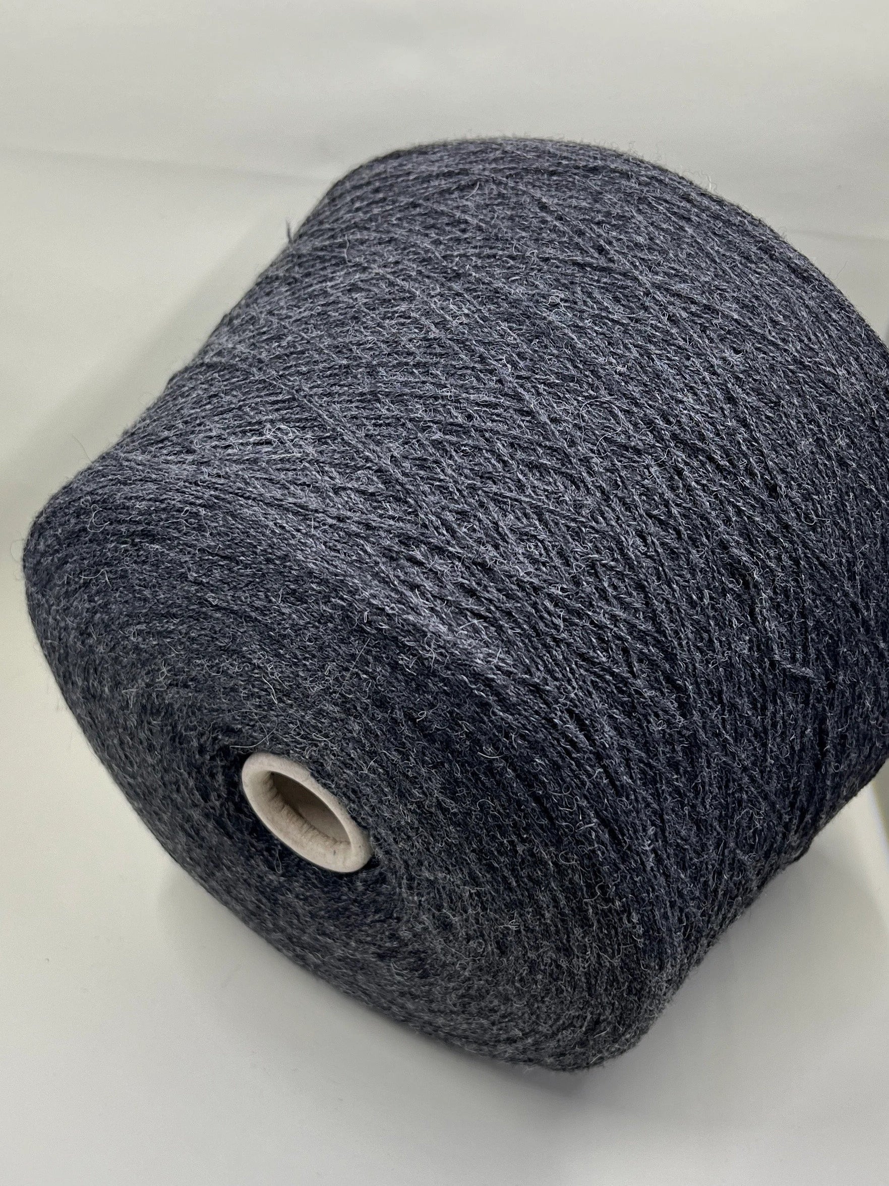 Fibre: 85% Alpaca Yarn, 15% merino wool yarn. Yarn on Cone for machine or hand knitting. Reference: Profillo TULUM Nm 2/12000 Weight: your choice Footage: 600m per 100g/ 656 yard per 3.35oz. Country: Italy. Color: Grigio mel. Can be used for knitting (both machine and hand).