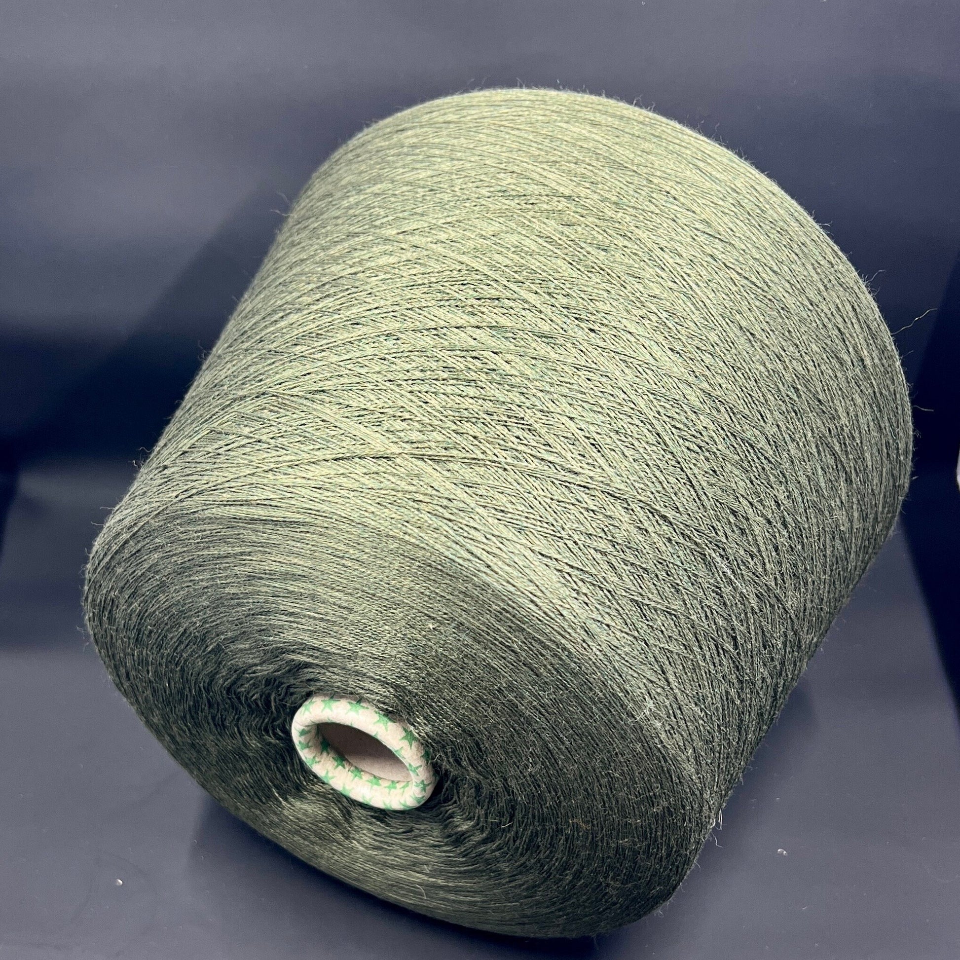 Material: 100% Extra Fine Merino Wool Yarn by Tollegno, HARMONY 4. Fiber Composition: 100% Extrafine Merino Wool yarn. Color: Oliva. Experience the luxurious softness of our 100% Fine Merino Merino Wool Yarn. This yarn showcases the exceptional quality of Extra Fine Merino wool.