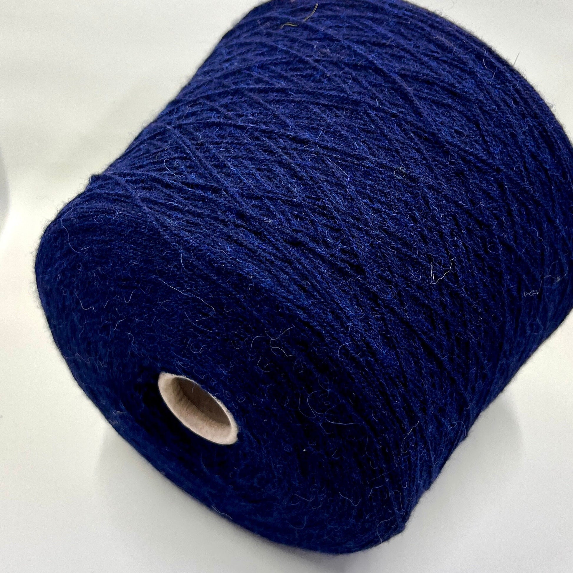 Reference: Profillo NM 2/12000 TULUM. Fibre: 85% Alpaca Yarn, 15% merino wool yarn. Country: Italy fine yarn. Color: Blue Navy mel. Can be used for knitting (both machine knitting and hand knitting). Yarn on cone.