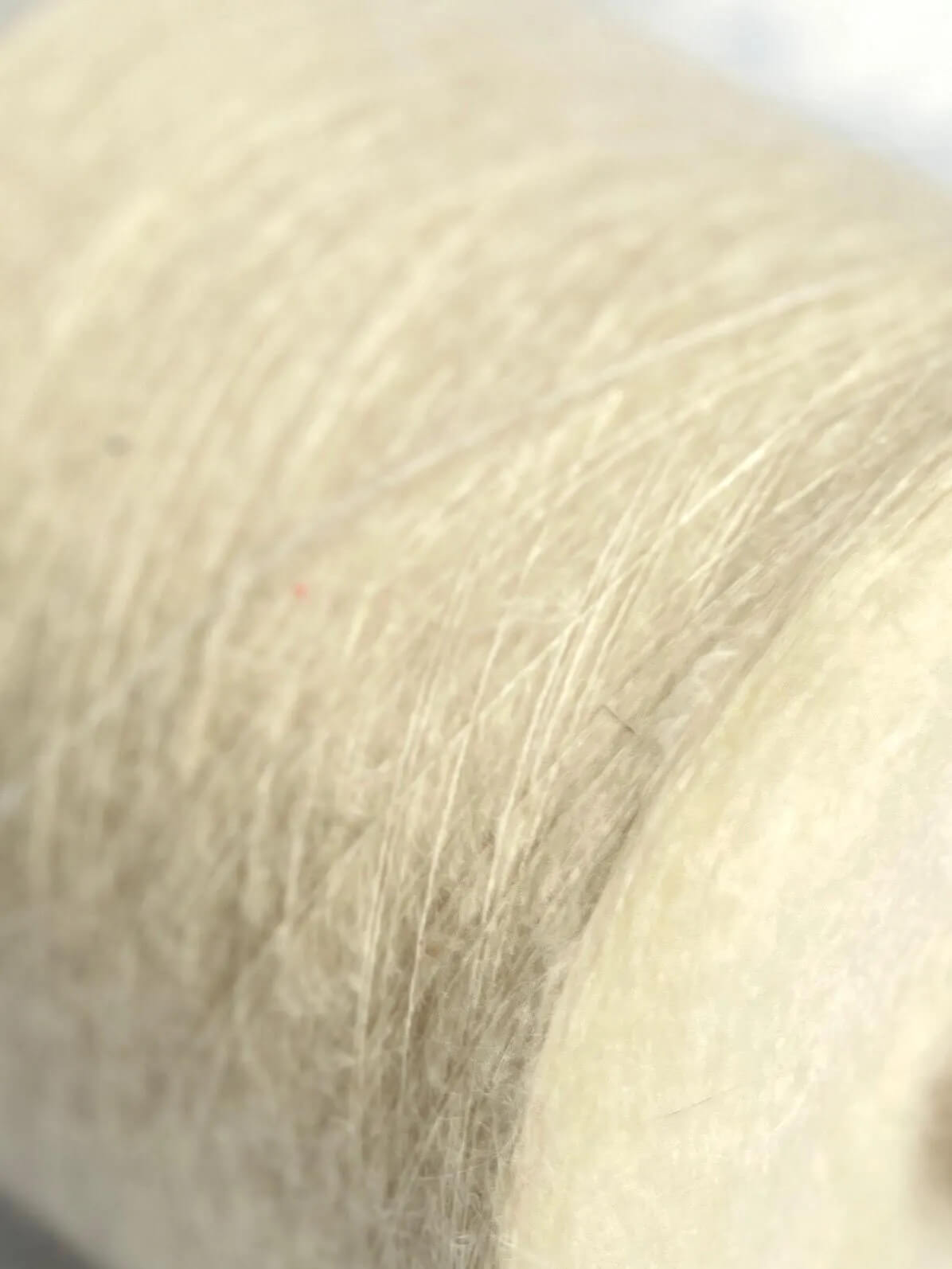SuperKidMohair Yarn 67%, PA Yarn 30%, Merino Yarn 3%. Yarn on Cone, Color White. Per 100 gr