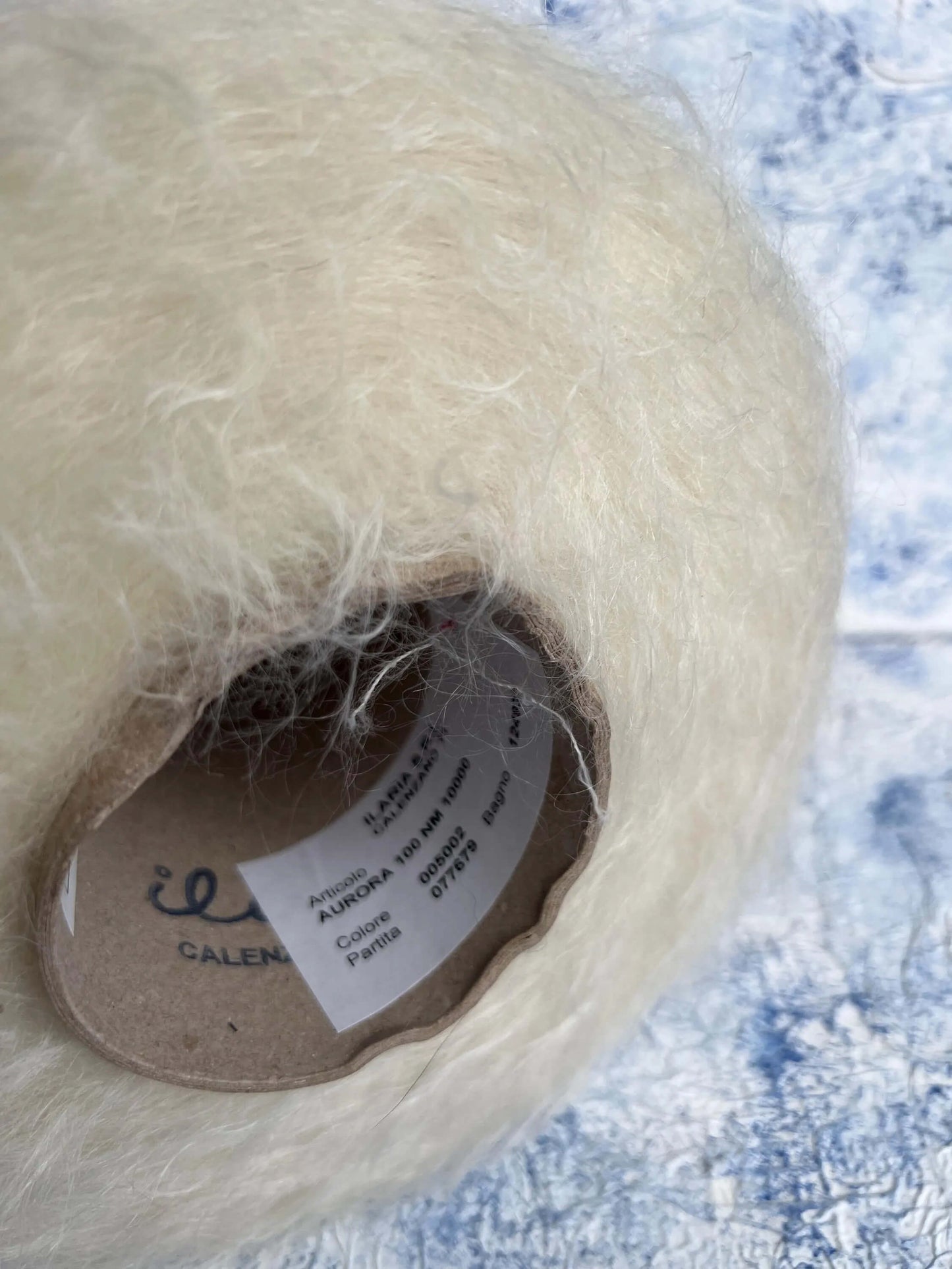 SuperKidMohair Yarn 67%, PA Yarn 30%, Merino Yarn 3%. Yarn on Cone, Color White. Per 100 gr
