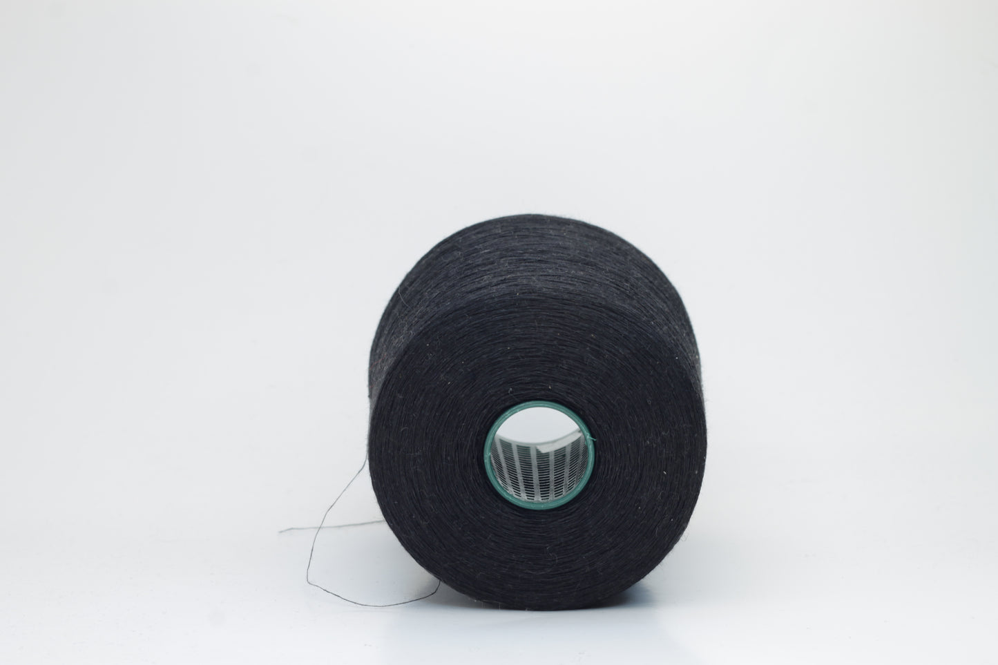 Fine, single-ply linen yarn in a Black. Reveals a crisp texture and subtle natural sheen, typical of pure linen fiber.