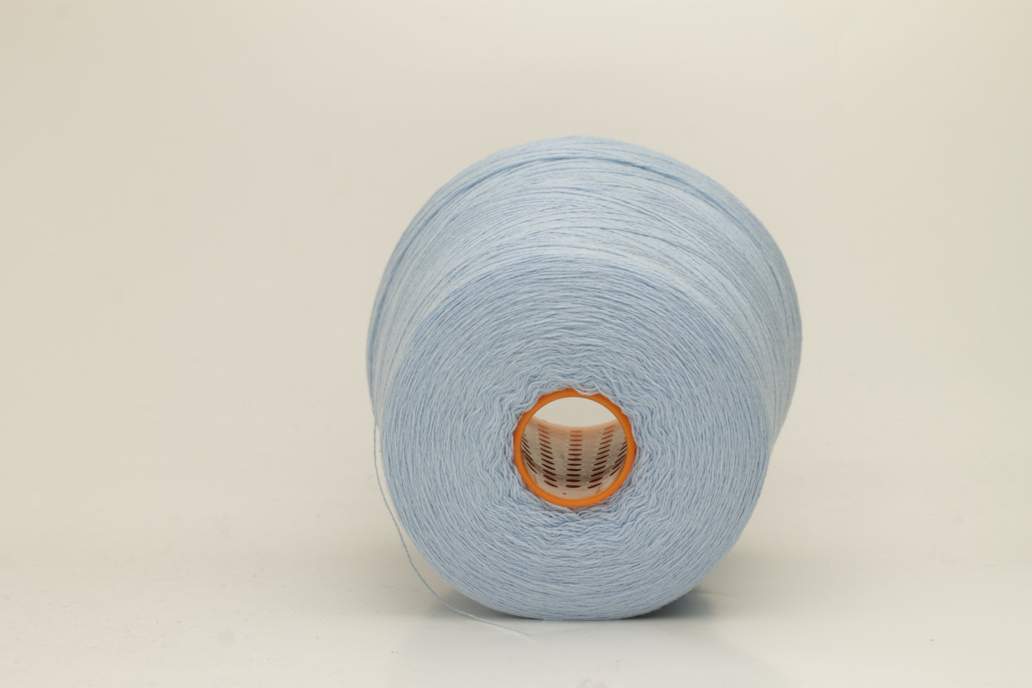 Close-up of a luxurious, soft Atlantic blue 2-ply cashmere yarn, subtly twisted with a delicate sheen and rich, deep color saturation.