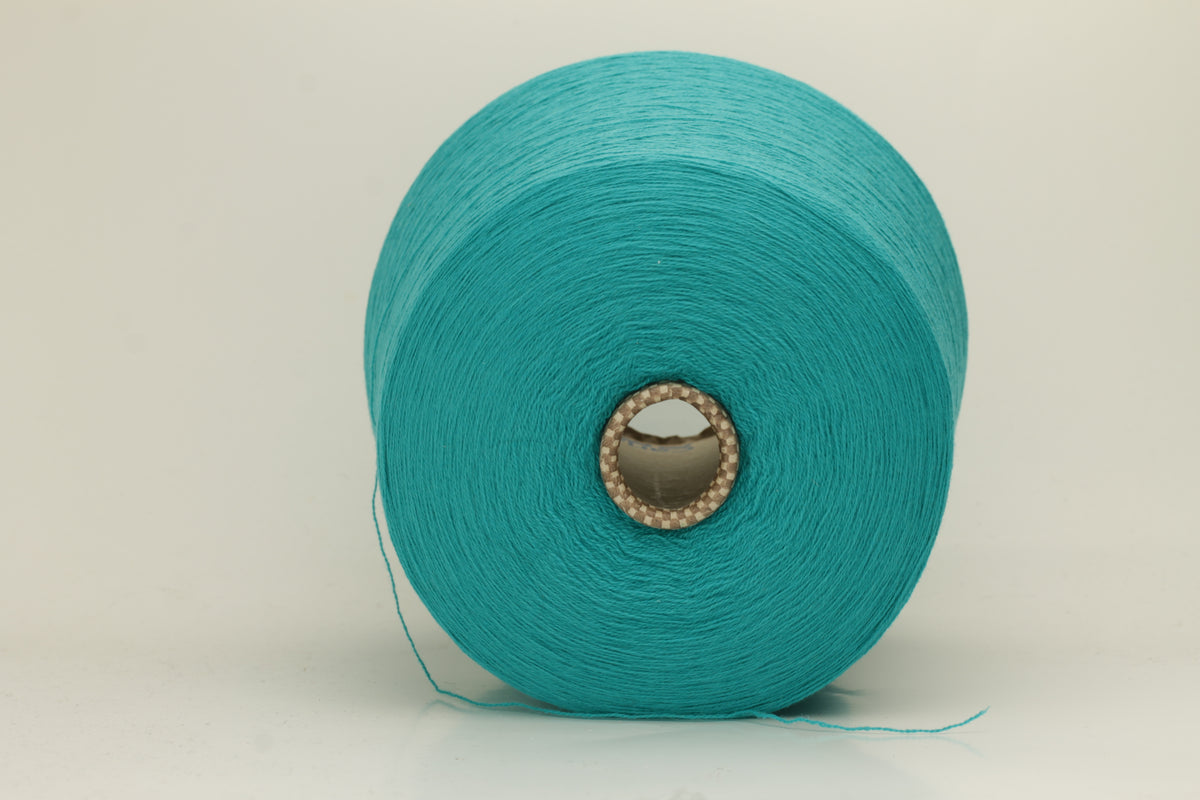 Vibrant grasshopper-green cashmere yarn. Soft, fine ply, subtle halo, and luxurious sheen. Displays rich, consistent color depth.