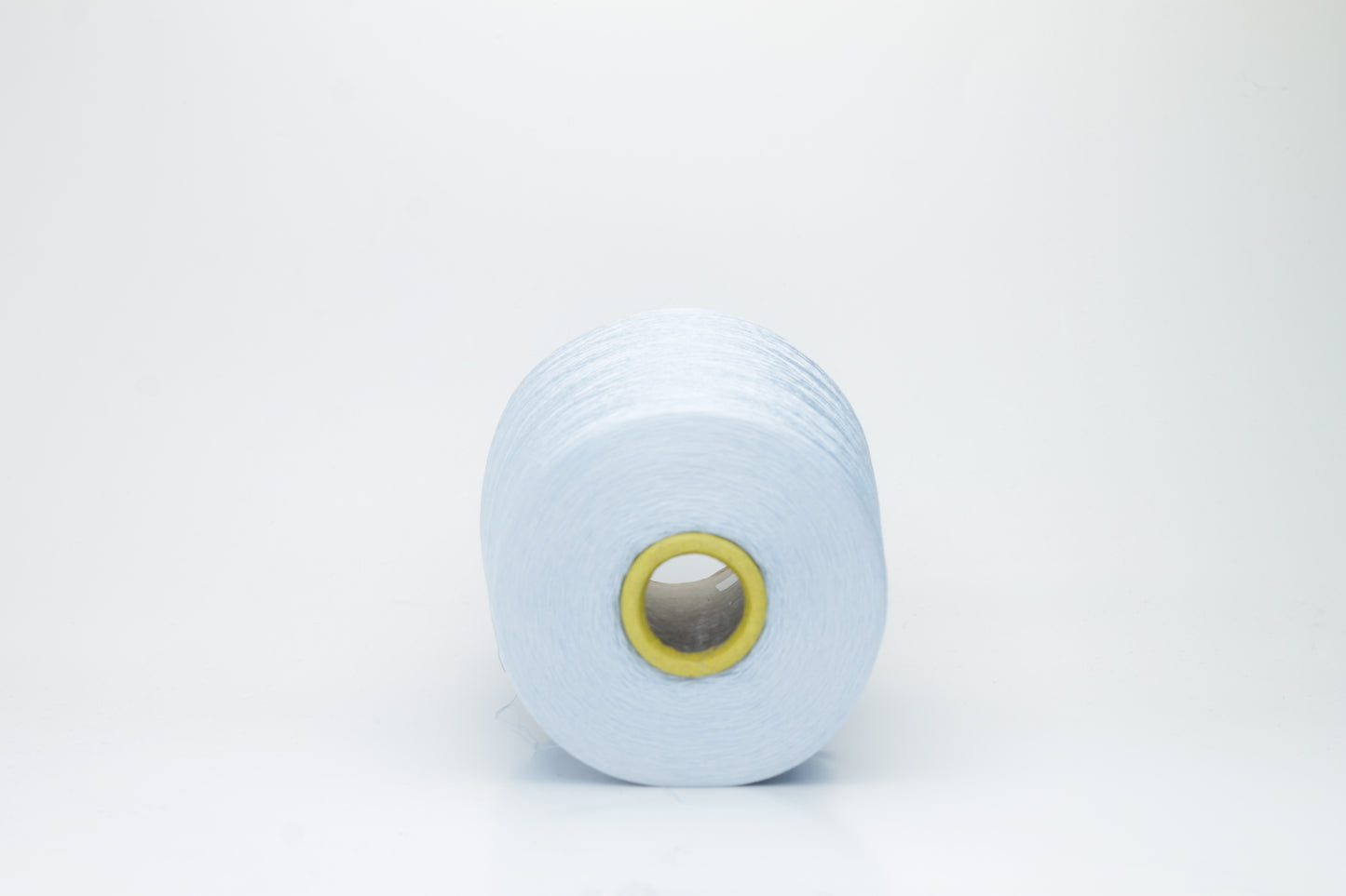 Close-up of radiant Azzurro blue silk yarn, featuring a finely spun, lustrous organzino thread with a pronounced, smooth sheen.