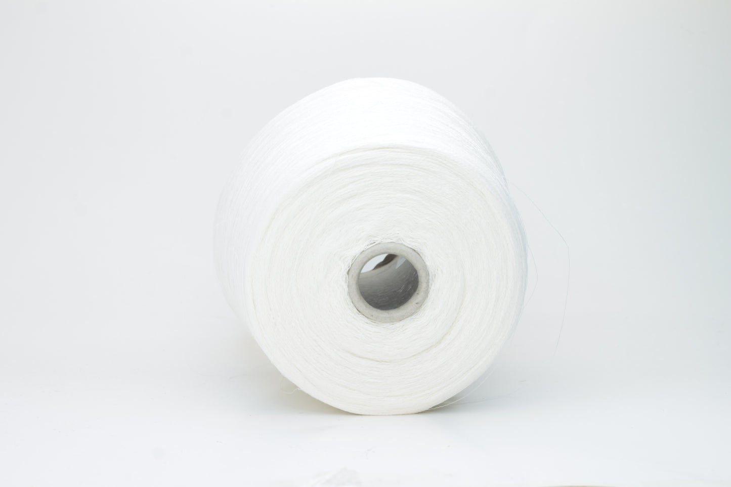 A bright white, single-ply yarn, subtly twisted, revealing the natural texture of linen fibers with a soft, understated sheen.