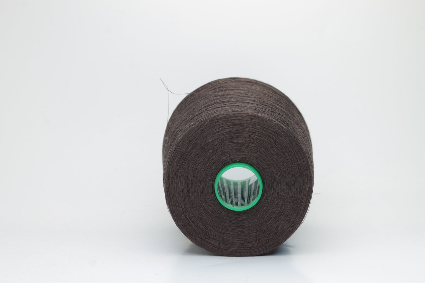 Fine, single-ply linen yarn in a rich Brown. Reveals a crisp texture and subtle natural sheen, typical of pure linen fiber.