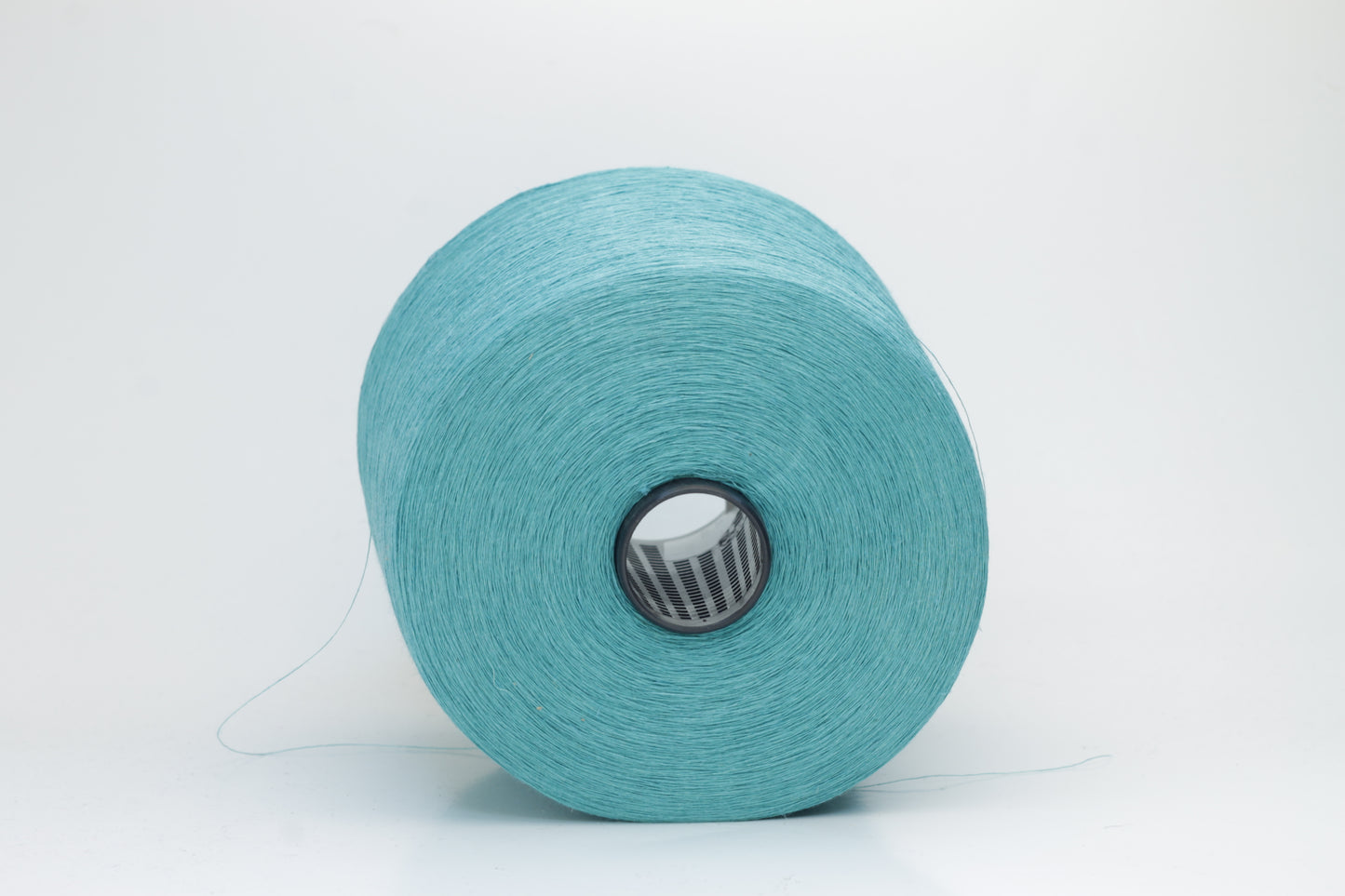Fine, single-ply linen yarn in a Turquoise. Reveals a crisp texture and subtle natural sheen, typical of pure linen fiber.
