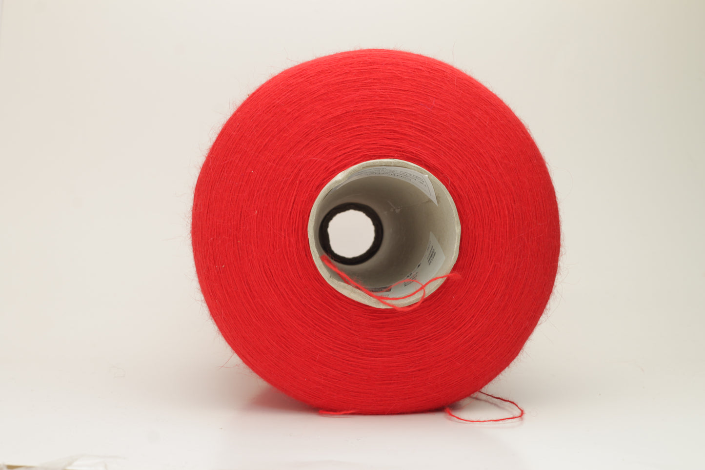 Angora 70%, 20% PA, 10% WV. Nm 1/15 Gold Extra. Color Red