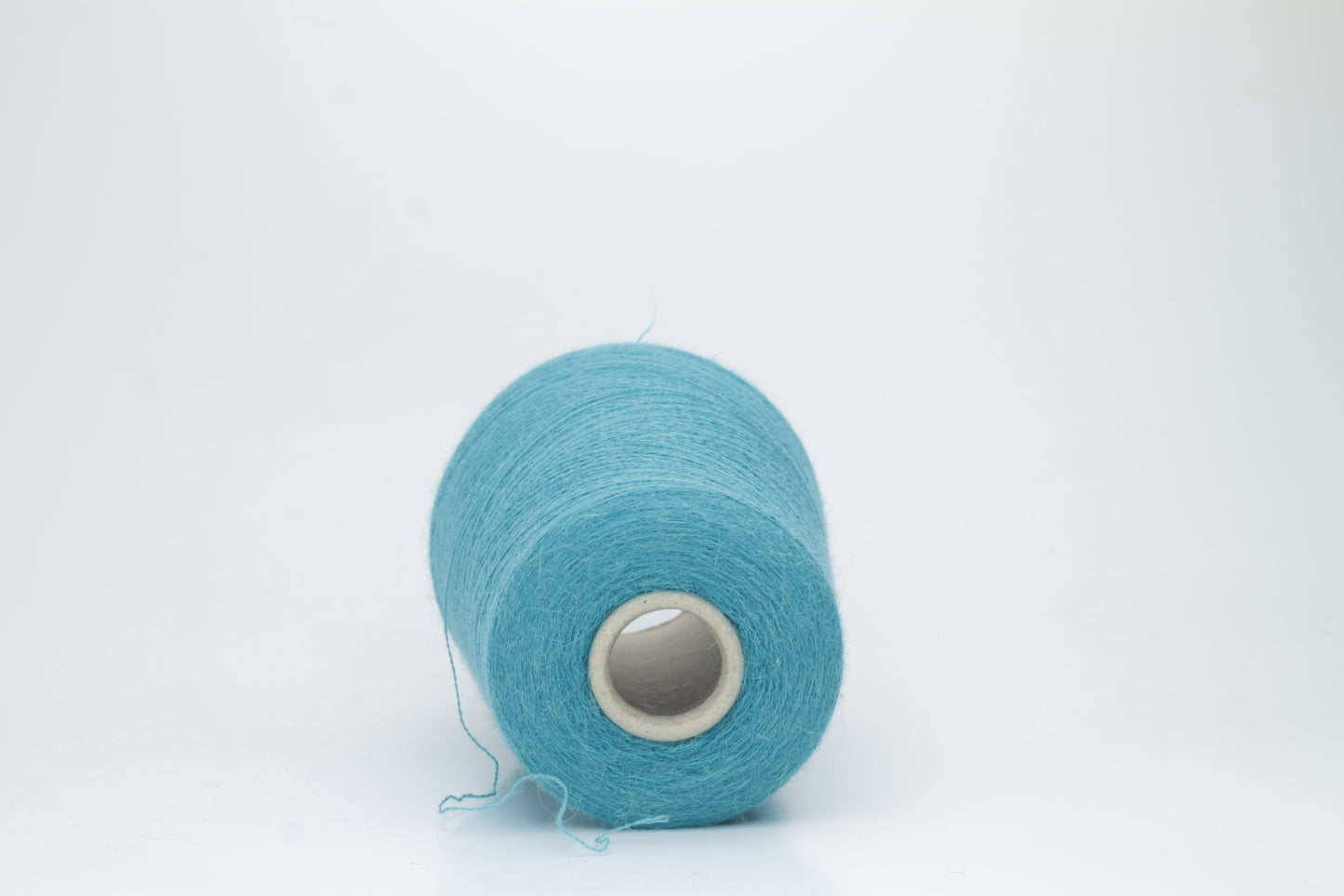 Rich Petrol 2-ply Alpaca Merino yarn, softly twisted with a gentle halo and subtle sheen, showcasing its deep, luxurious color saturation.