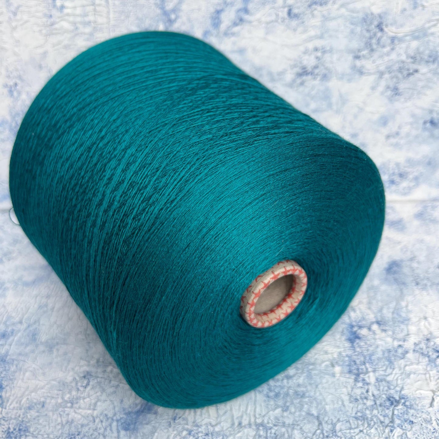 100% Merino yarn, Yarn on cone, Color DarkCyan. Per 100 gr