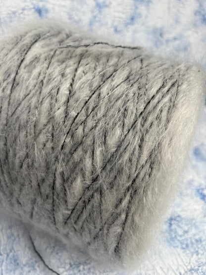 70% Kid Mohair&15% Wool,15% PA yarn on cone. White&Black.Per 100 gr