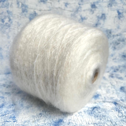 70% Kid Mohair&15% Wool&15% PA yarn on Cone. White.Per 100 gr