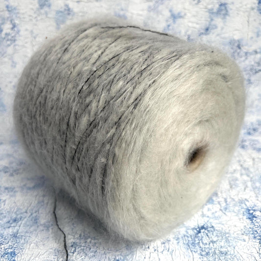 70% Kid Mohair&15% Wool,15% PA yarn on cone. White&Black.Per 100 gr