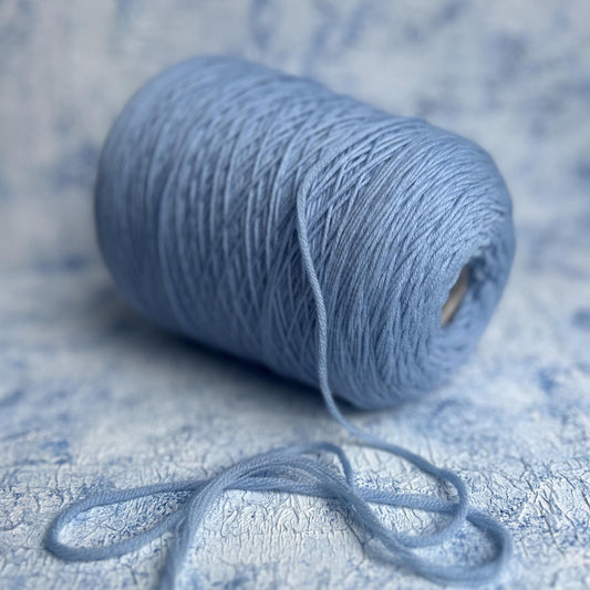 100% Merino wool yarn, IGEA Aquila yarn on cone, Color Light Blue. Per 100 gr