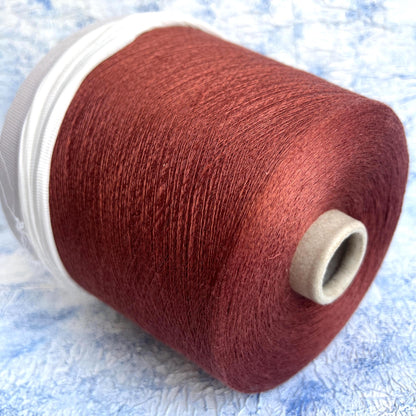 Linen yarn 83% & Silk yarn 17%.Yarn opn cone for knitting. Rust.Per 100 gr