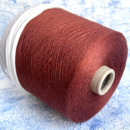 Linen yarn 83% & Silk yarn 17%.Yarn opn cone for knitting. Rust.Per 100 gr