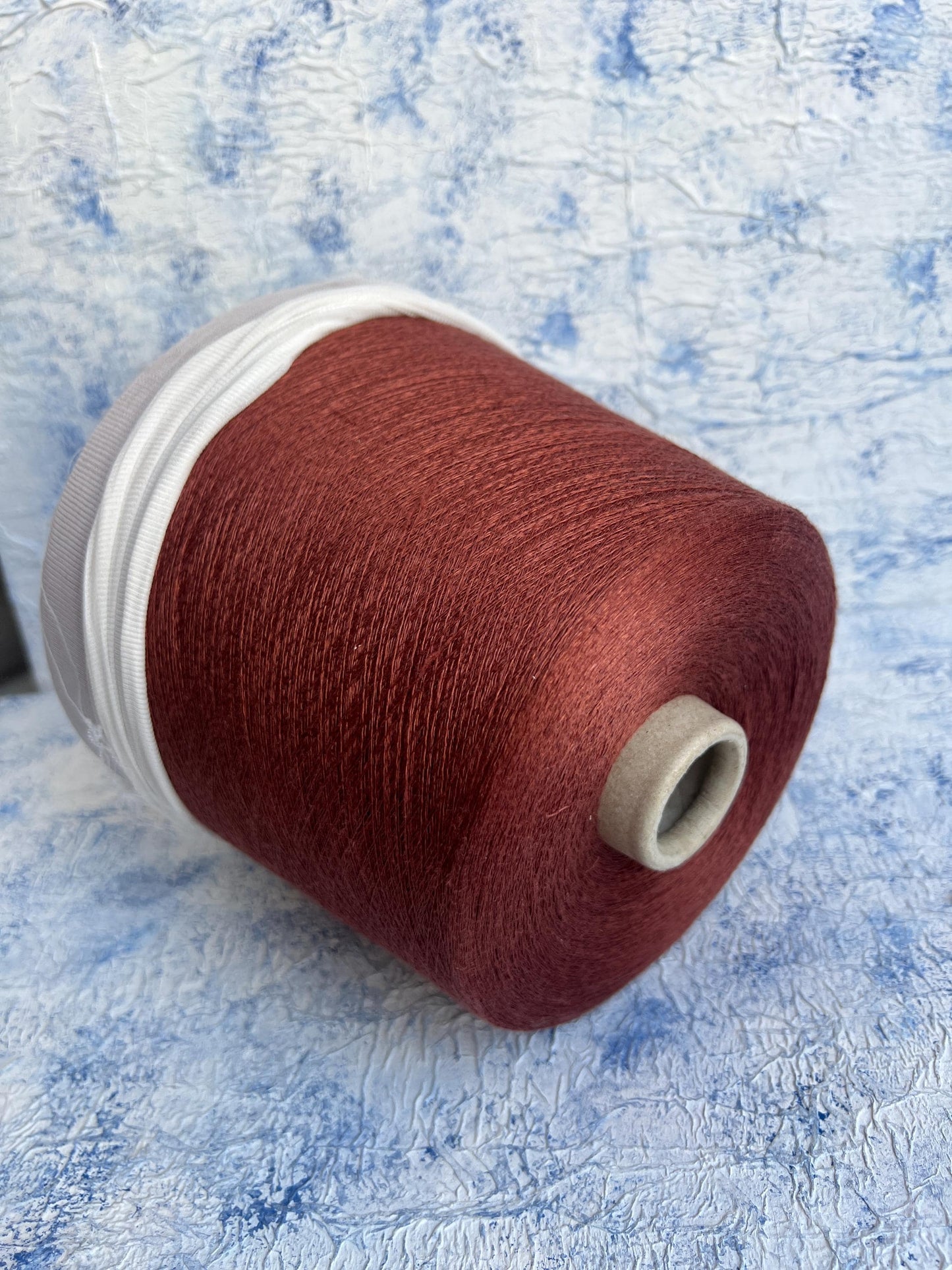Linen yarn 83% & Silk yarn 17%.Yarn opn cone for knitting. Rust.Per 100 gr