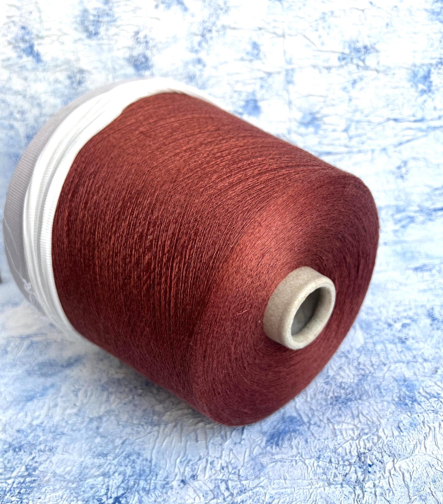 Linen yarn 83% & Silk yarn 17%.Yarn opn cone for knitting. Rust.Per 100 gr