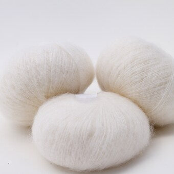 Very soft mohair lace weight yarn for crochet and knitting.Reference: Cortina Fibre: 57% mohair yarn, 28% silk yarn, 15% wool yarn. Yarn Color: White (Natural). This is a luxurious, very soft and fluffy mohair yarn with a wonderful composition. Can be used for hand knitting and crochet. You can buy in our Yarn Store