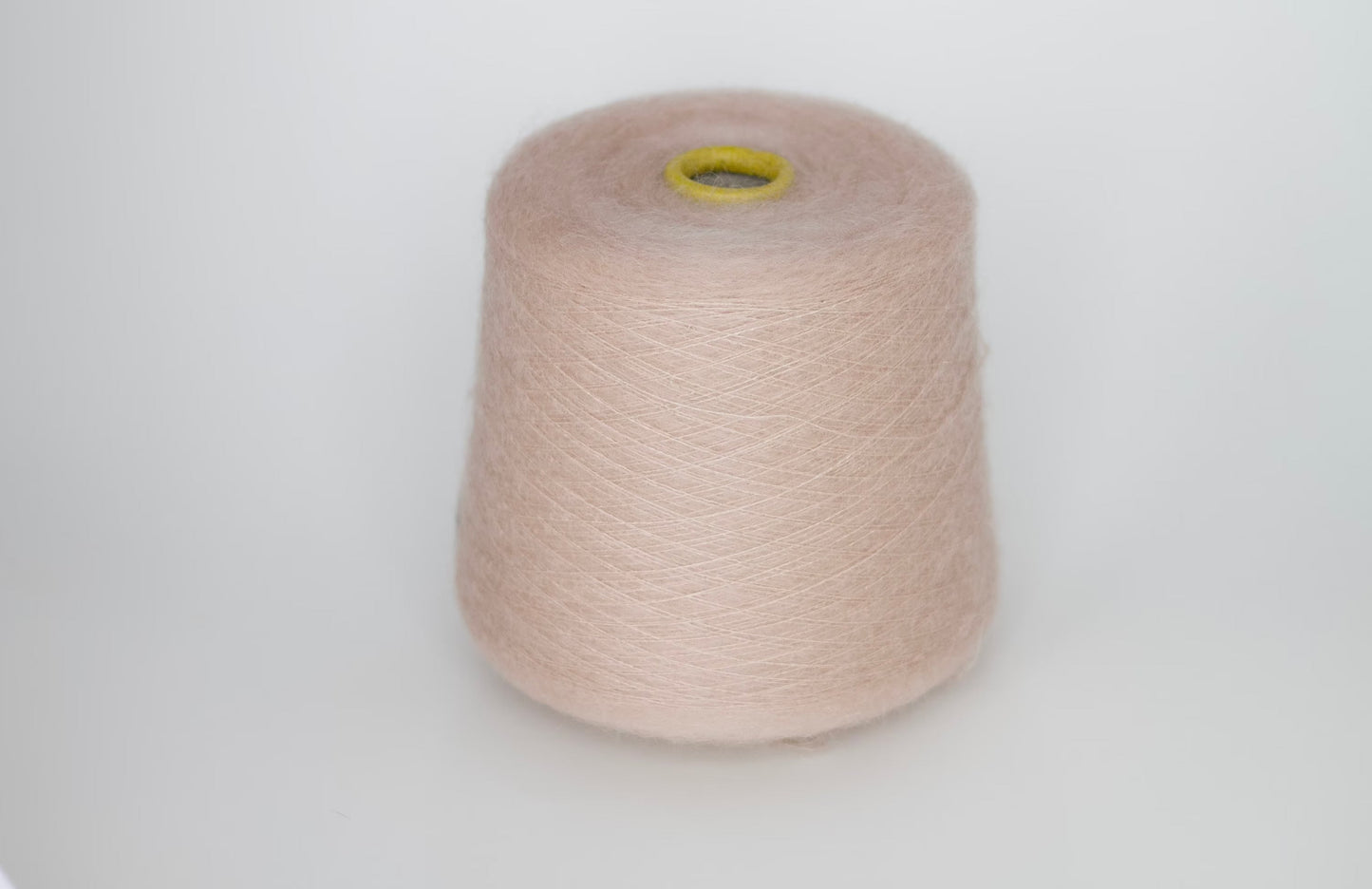 Reference: Sesia Vivienne Yarn. Fibre: 70% kid mohair yarn, 30% silk yarn. Yarn on cone. This is a luxurious, very soft and fluffy yarn with a wonderful composition of 70% Super Kid mohair and 30% silk. Can be used for knitting (both machine and hand) this yarn is available at our Yarn Store in Canada