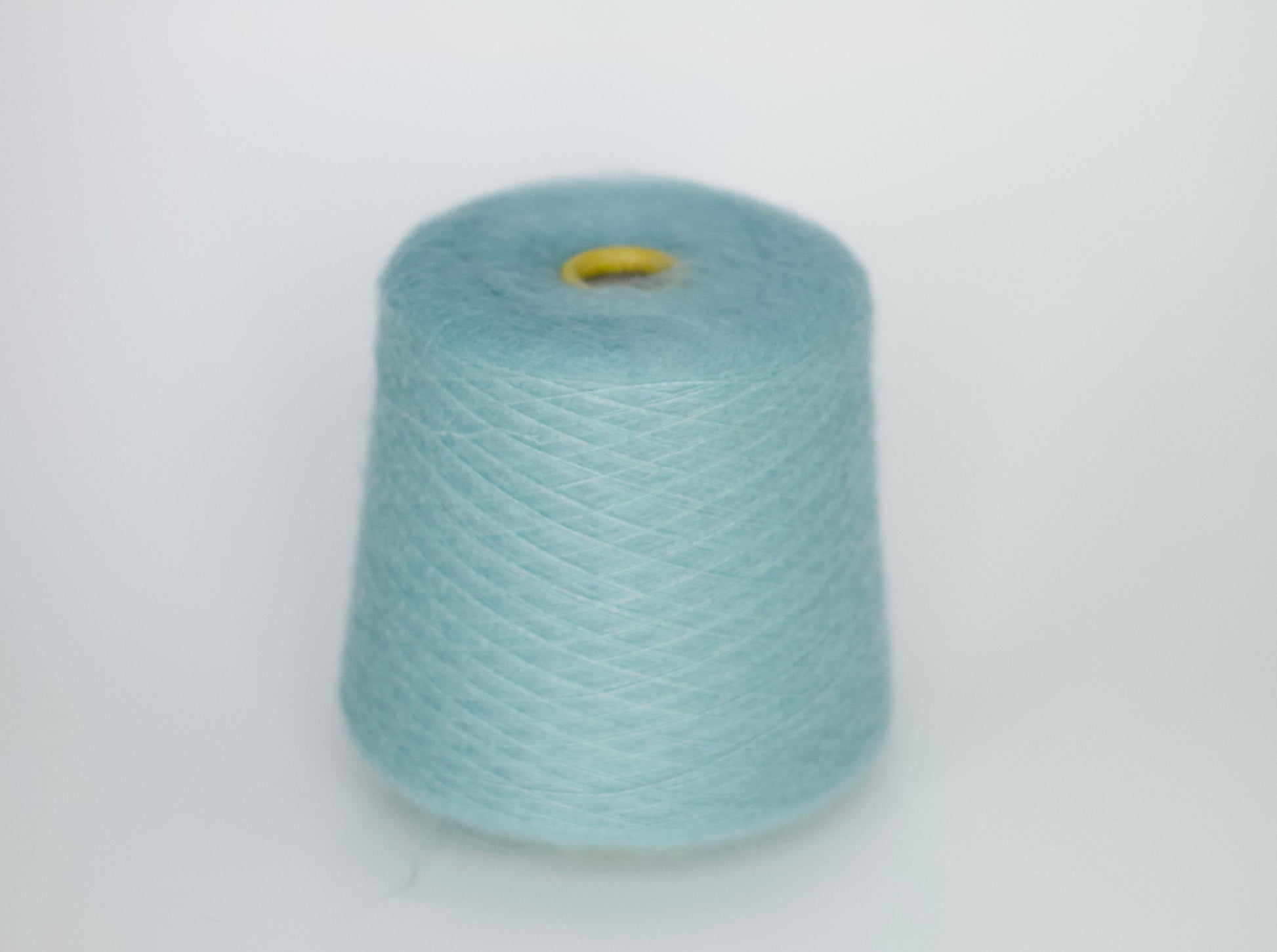 Reference: Sesia Vivienne Yarn. Fibre: 70% kid mohair yarn, 30% silk yarn. Yarn on cone. This is a luxurious, very soft and fluffy yarn with a wonderful composition of 70% Super Kid mohair and 30% silk. Can be used for knitting (both machine and hand) this yarn is available at our Yarn Store in Canada