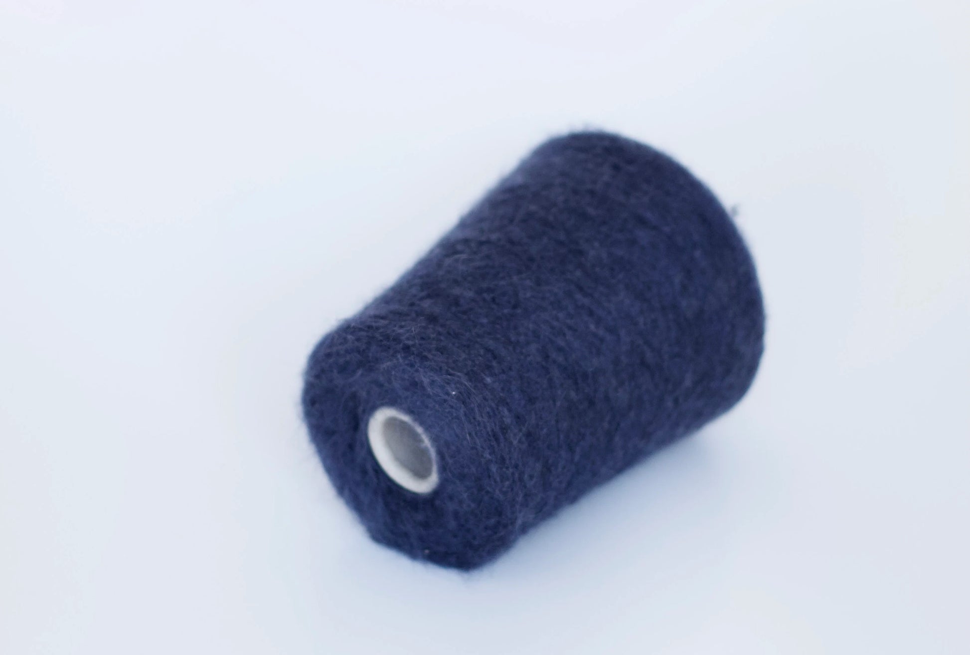 Fibre: 38% kid mohair yarn, 38% merino yarn, 19% polyamide yarn, 5% elastane yarn. Country: Italy. Color: navy. This is a luxurious, very soft and fluffy yarn with a wonderful composition available at our Yarn Store in Canada. Can be used for knitting (both machine and hand).