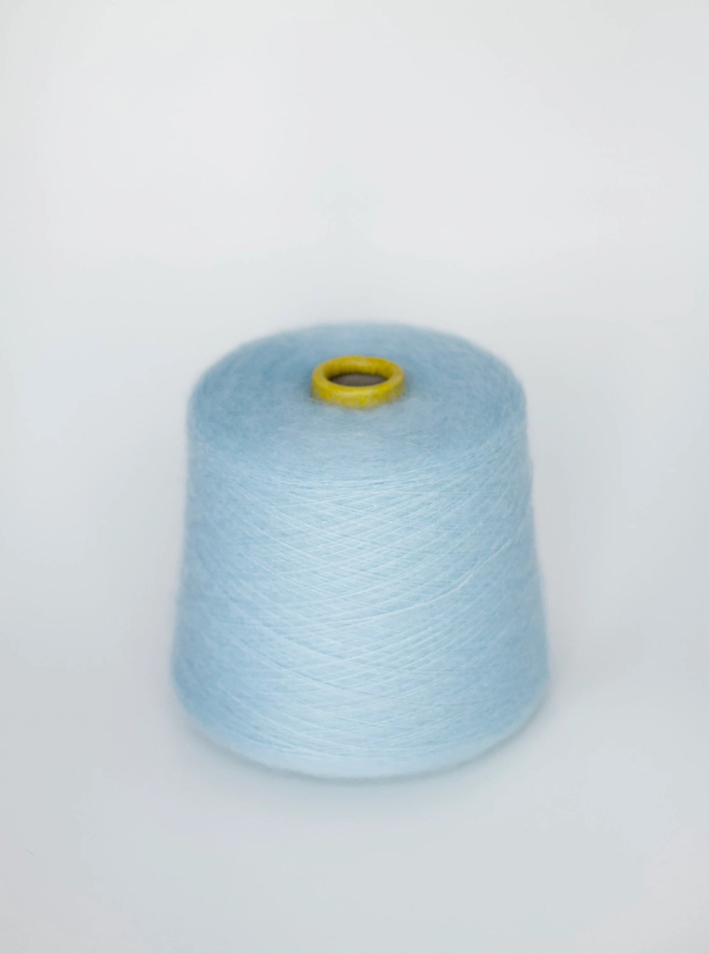 Reference: Sesia Vivienne Yarn. Fibre: 70% kid mohair yarn, 30% silk yarn. Yarn on cone. This is a luxurious, very soft and fluffy yarn with a wonderful composition of 70% Super Kid mohair and 30% silk. Can be used for knitting (both machine and hand) this yarn is available at our Yarn Store in Canada