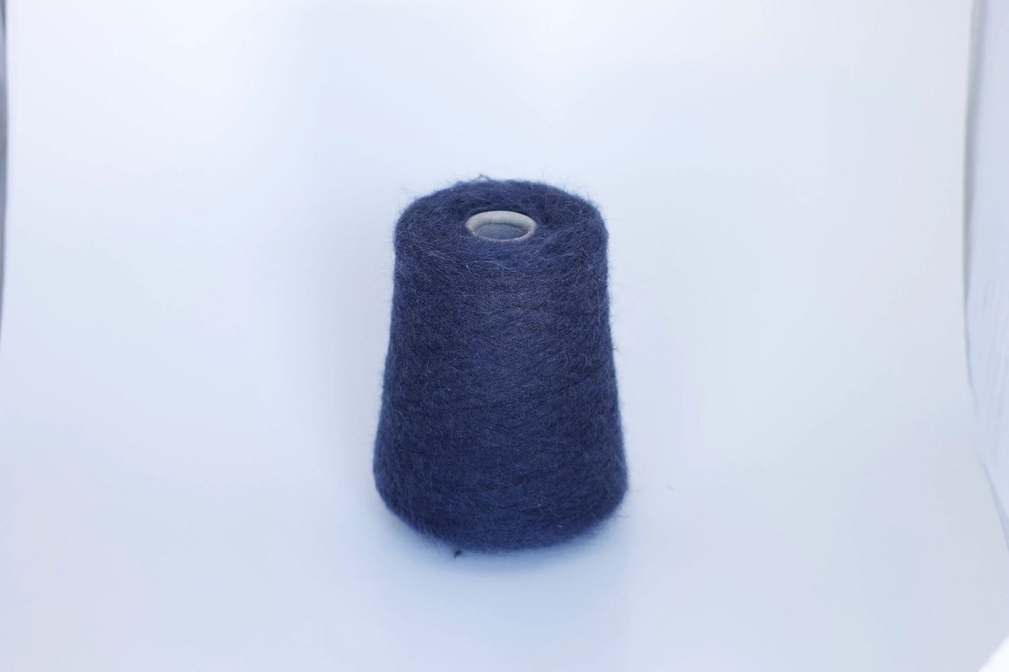 Fibre: 38% kid mohair yarn, 38% merino yarn, 19% polyamide yarn, 5% elastane yarn. Country: Italy. Color: navy. This is a luxurious, very soft and fluffy yarn with a wonderful composition available at our Yarn Store in Canada. Can be used for knitting (both machine and hand).