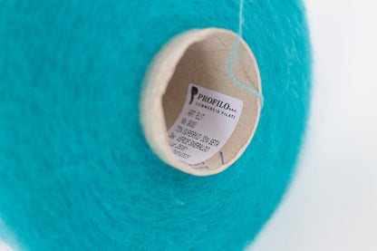 Reference: PROFILO S.N.O. Super Kid Seta yarn Art: ELITE. Fibre: 70% kid mohair yarn, 30% silk yarn. Yarn on cone. This is a luxurious, very soft and fluffy yarn with a wonderful composition of 70% Super Kid mohair yarn and 30% silk yarn. Can be used for knitting (both machine and hand)