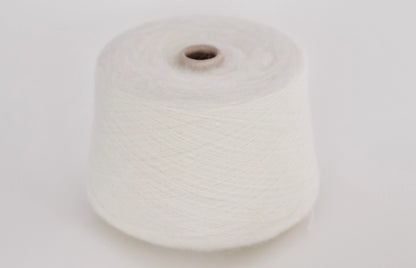 Super Kid Mohair Yarn & Poliamide Yarn. Fibre: 70% Super kid mohair Yarn, 30% Poliamide Yarn. Reference: PROFILO S.N.C. Color: white. This is a luxurious yarn, very soft and fluffy yarn with a wonderful composition yarn of 70% Super Kid mohair yarn and 30% PA yarn. Can be used for knitting (both machine and hand).