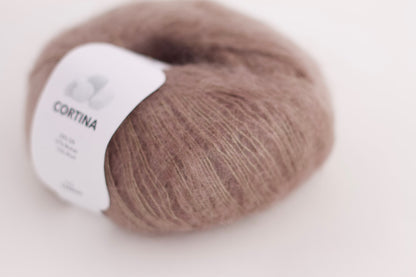 Very soft mohair lace weight yarn for crochet and knitting. Reference: Cortina Fibre: 57% mohair yarn, 28% silk yarn, 15% wool yarn. This is a luxurious, very soft and fluffy mohair yarn with a wonderful composition. Can be used for hand knitting and crochet.