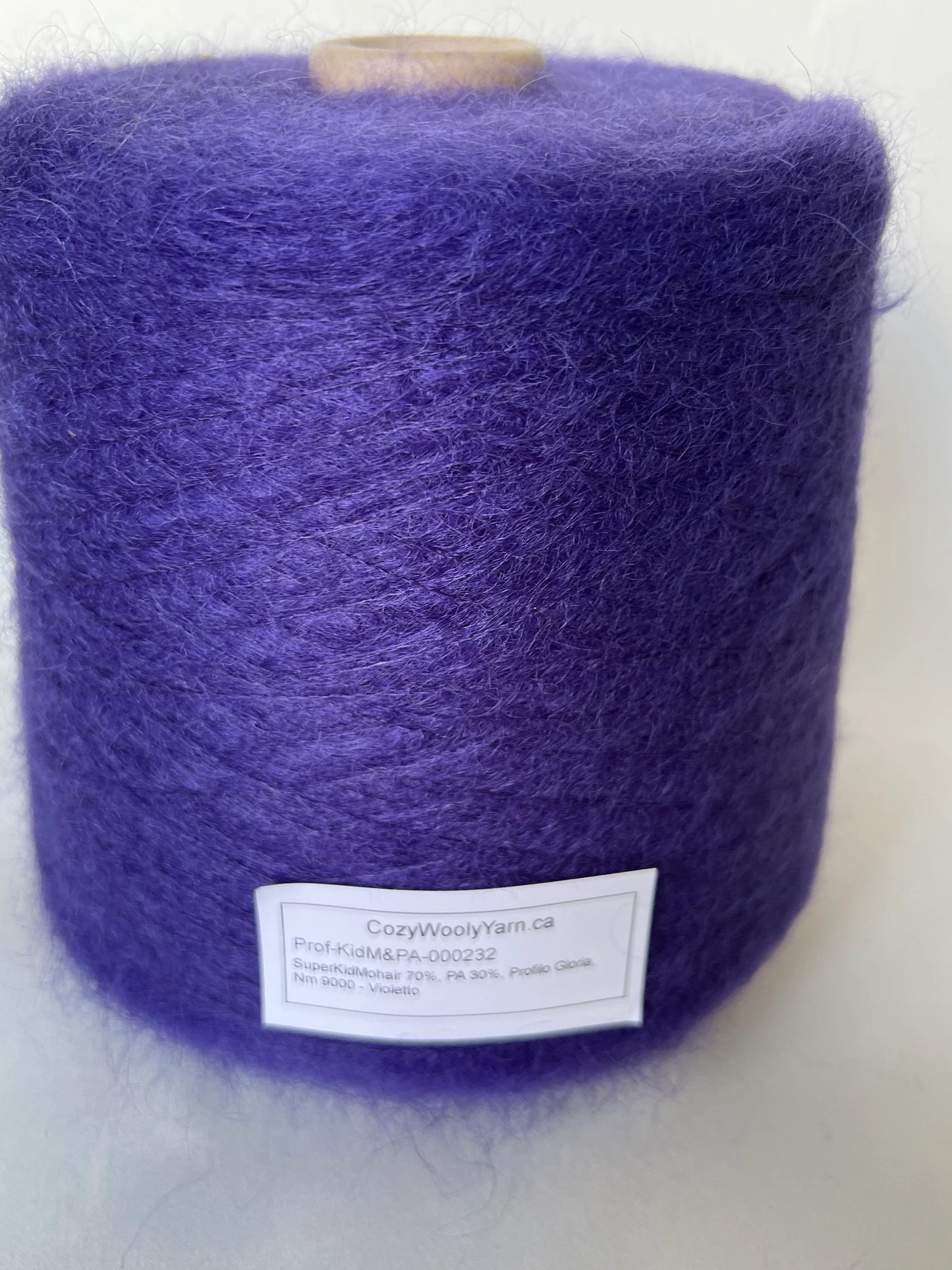 Reference: Super Kid mohair Yarn & Poliamide Yarn. PROFILO Yarn, Art: GLOPIA. Fibre: 70% Super kid mohair Yarn, 30% PA Yarn. Color: Violetto. This is a luxurious yarn, very soft and fluffy yarn with a wonderful composition of 70% Super Kid mohair yarn and 30% PA Yarn. Yarn on Cone. Yarn for knitting.