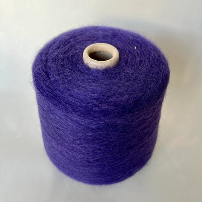 Reference: Super Kid mohair Yarn & Poliamide Yarn. PROFILO Yarn, Art: GLOPIA. Fibre: 70% Super kid mohair Yarn, 30% PA Yarn. Color: Violetto. This is a luxurious yarn, very soft and fluffy yarn with a wonderful composition of 70% Super Kid mohair yarn and 30% PA Yarn. Yarn on Cone. Yarn for knitting.