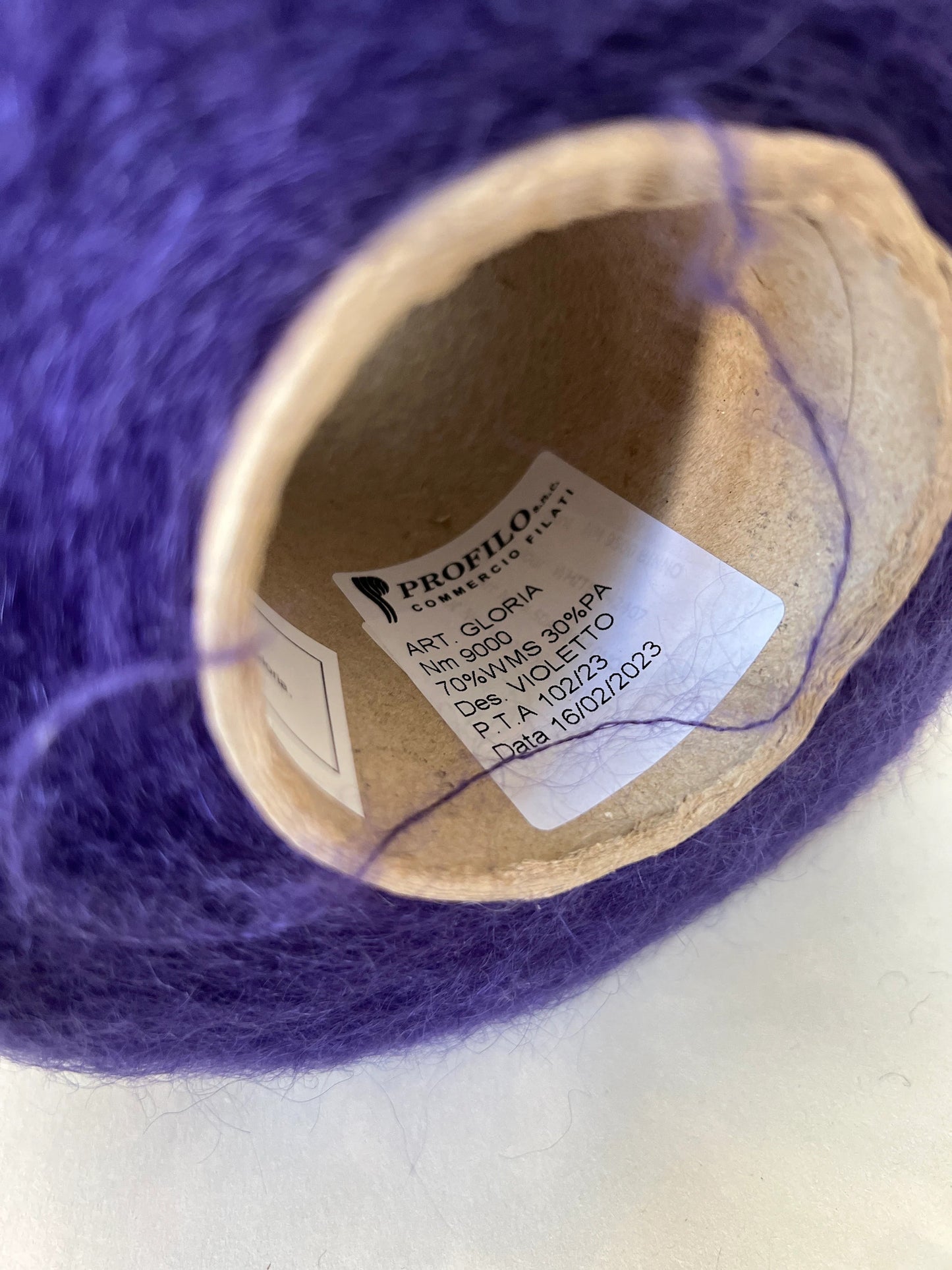 Reference: Super Kid mohair Yarn & Poliamide Yarn. PROFILO Yarn, Art: GLOPIA. Fibre: 70% Super kid mohair Yarn, 30% PA Yarn. Color: Violetto. This is a luxurious yarn, very soft and fluffy yarn with a wonderful composition of 70% Super Kid mohair yarn and 30% PA Yarn. Yarn on Cone. Yarn for knitting.