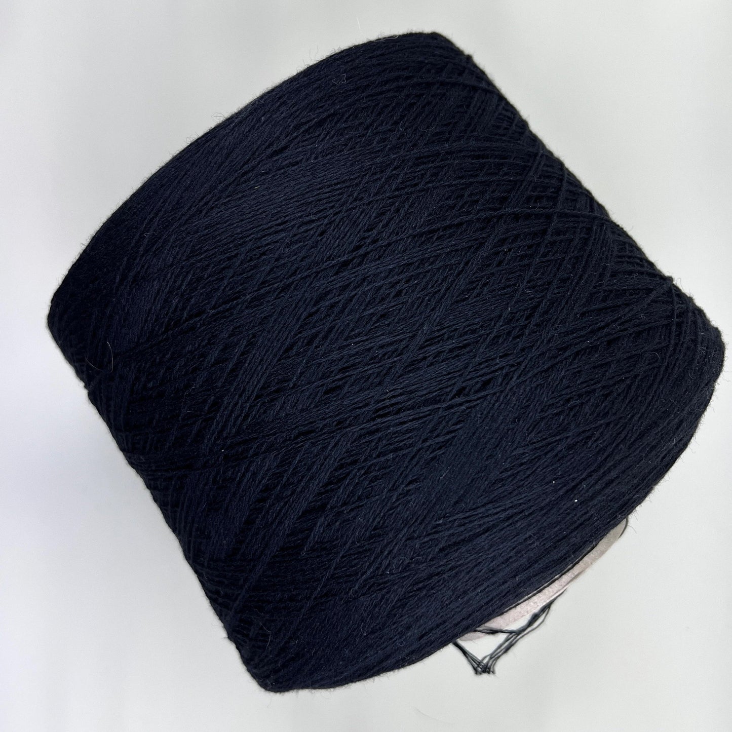 Material: 100% Merino Wool Yarn by Filpucci Industrie - Art: UPWOOL. Fiber Composition: 100% Merino Wool yarn. Yarn Color: Deep Black. Experience the luxurious softness of 100% Merino Wool Yarn. This yarn showcases the exceptional quality of pure Merino wool. You can buy this Pure Merino Wool yarn in our Yarn Store