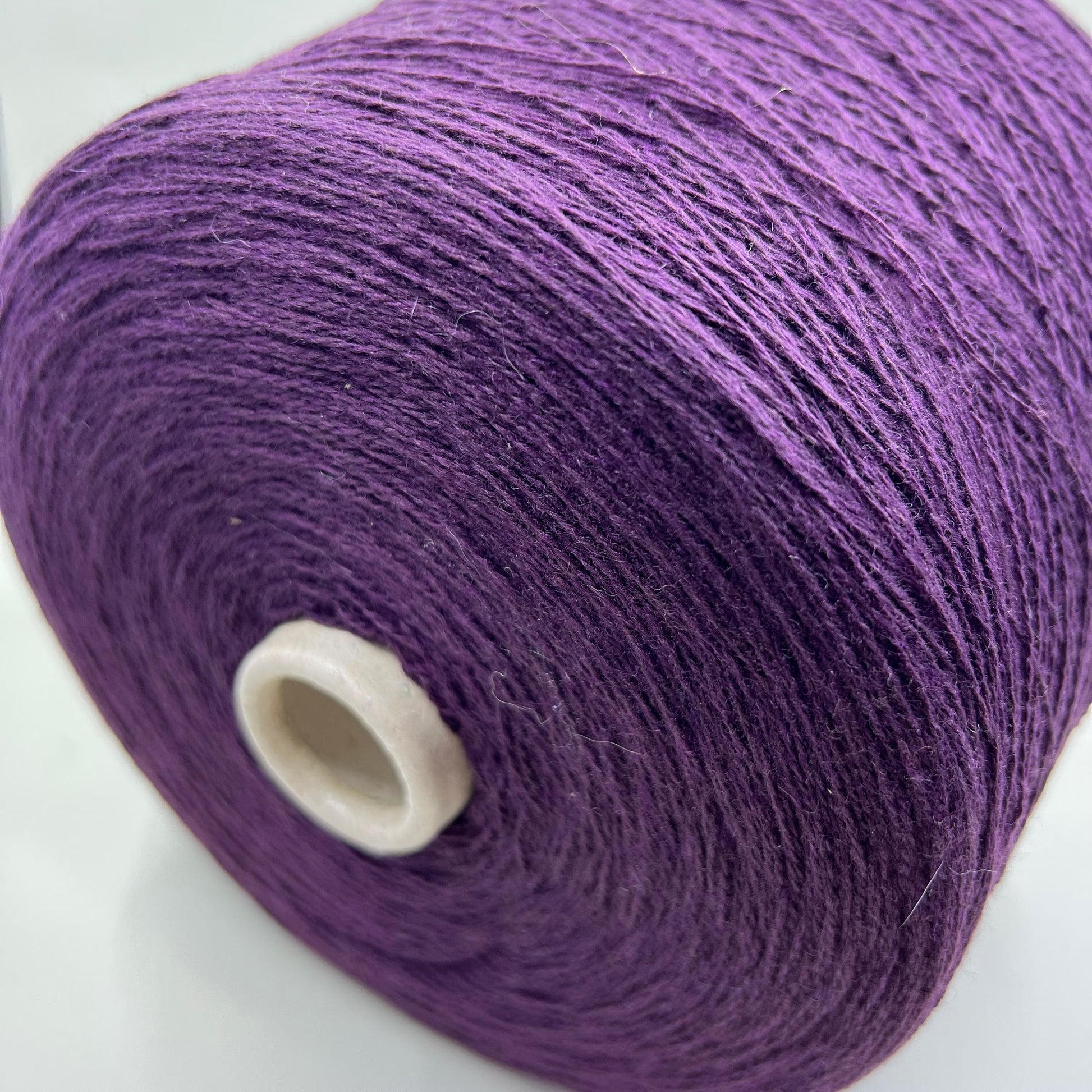 Material: 100% Merino Wool Yarn by Filpucci Industrie - Art: UPWOOL. Yarn Color: Deep Purple. This yarn boasts the exceptional quality of 100% pure Merino wool. This yarn can be purchased at our yarn store in Canada.