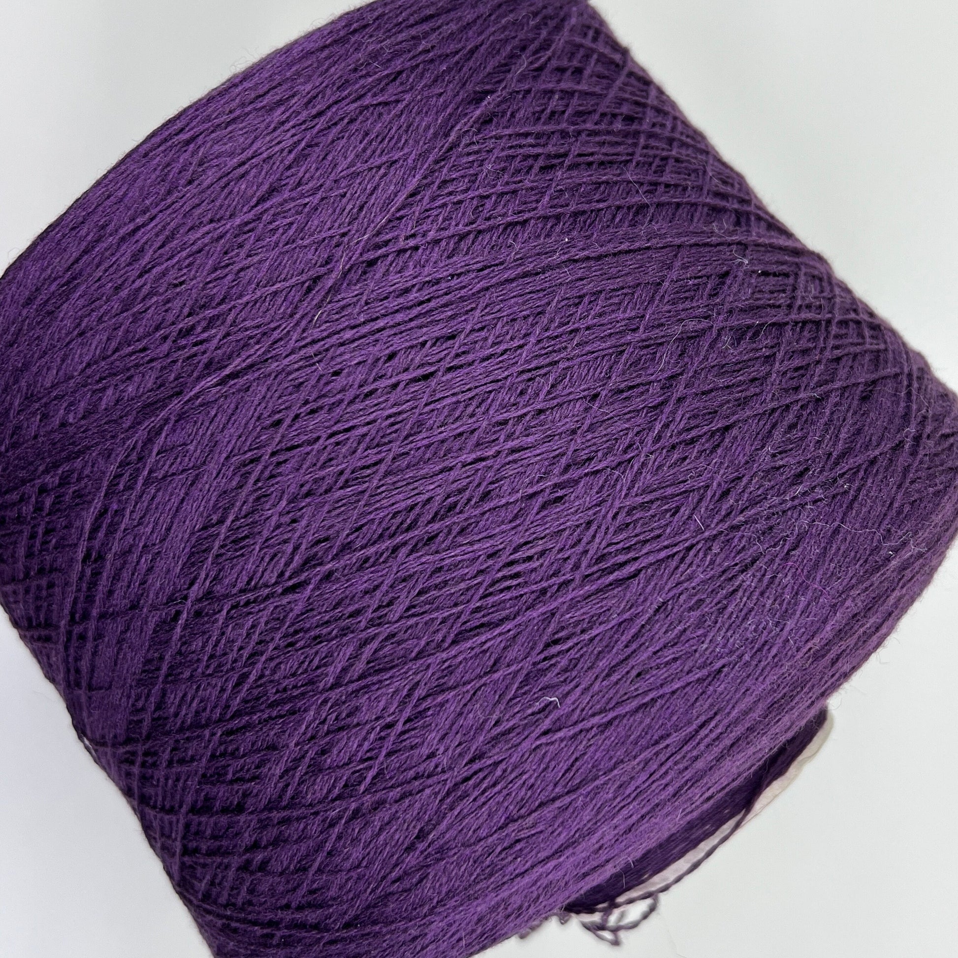 Material: 100% Merino Wool Yarn by Filpucci Industrie - Art: UPWOOL. Yarn Color: Deep Purple. This yarn boasts the exceptional quality of 100% pure Merino wool. This yarn can be purchased at our yarn store in Canada.