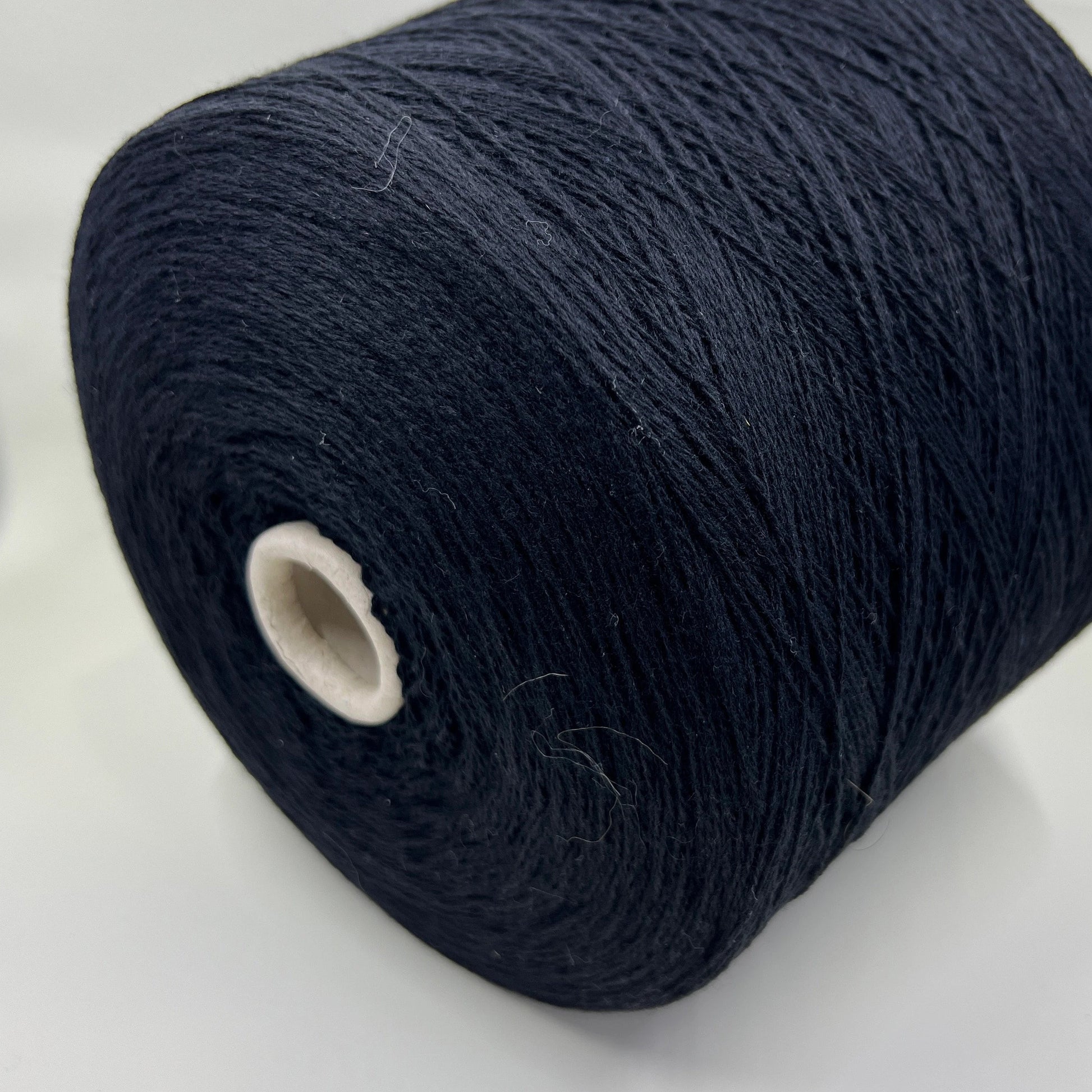 Material: 100% Merino Wool Yarn by Filpucci Industrie - Art: UPWOOL. Fiber Composition: 100% Merino Wool yarn. Yarn Color: Deep Black. Experience the luxurious softness of 100% Merino Wool Yarn. This yarn showcases the exceptional quality of pure Merino wool. You can buy this Pure Merino Wool yarn in our Yarn Store